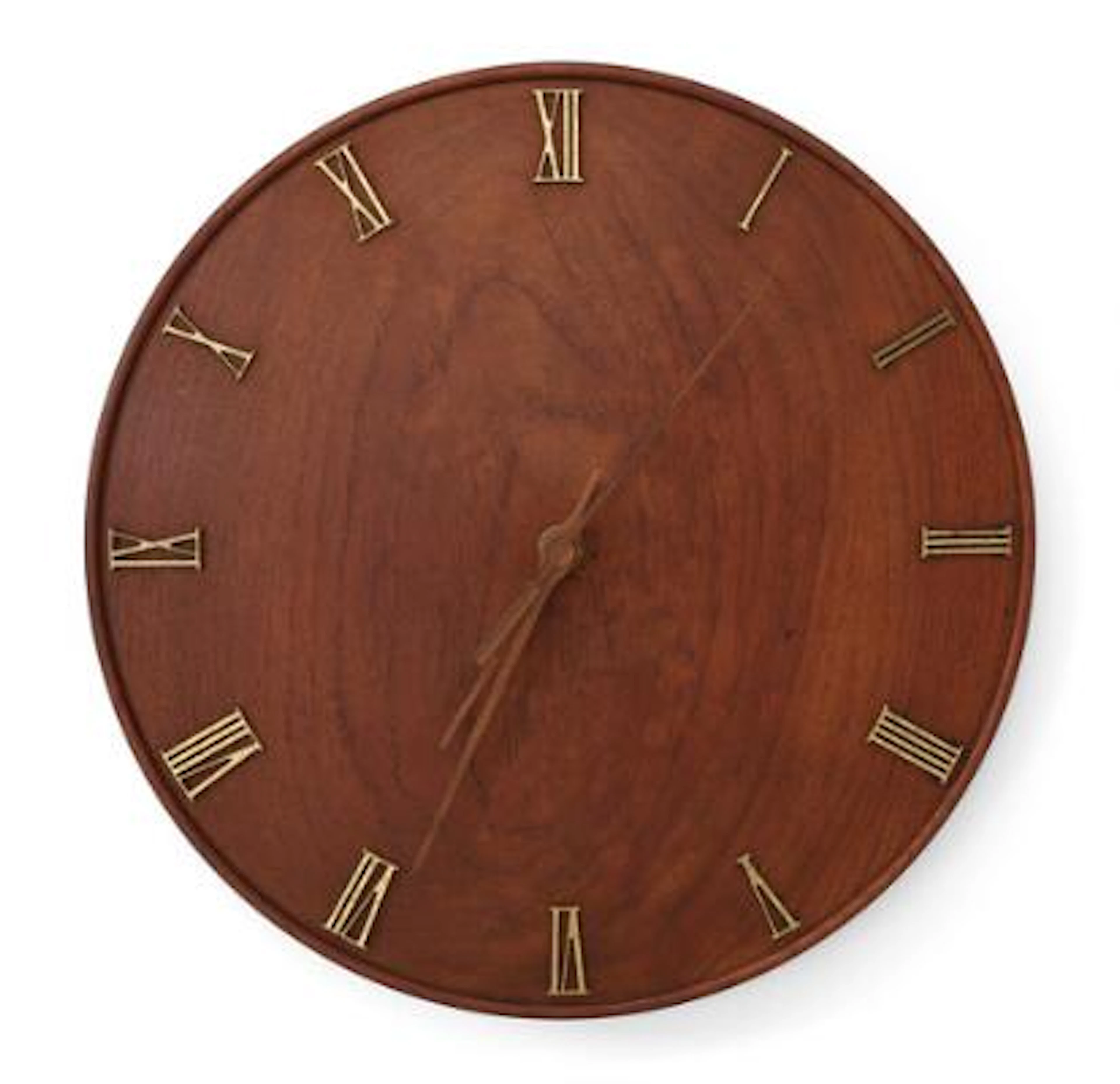 Kaj Gottlob: A circular teak wall clock with brass roman numbers.