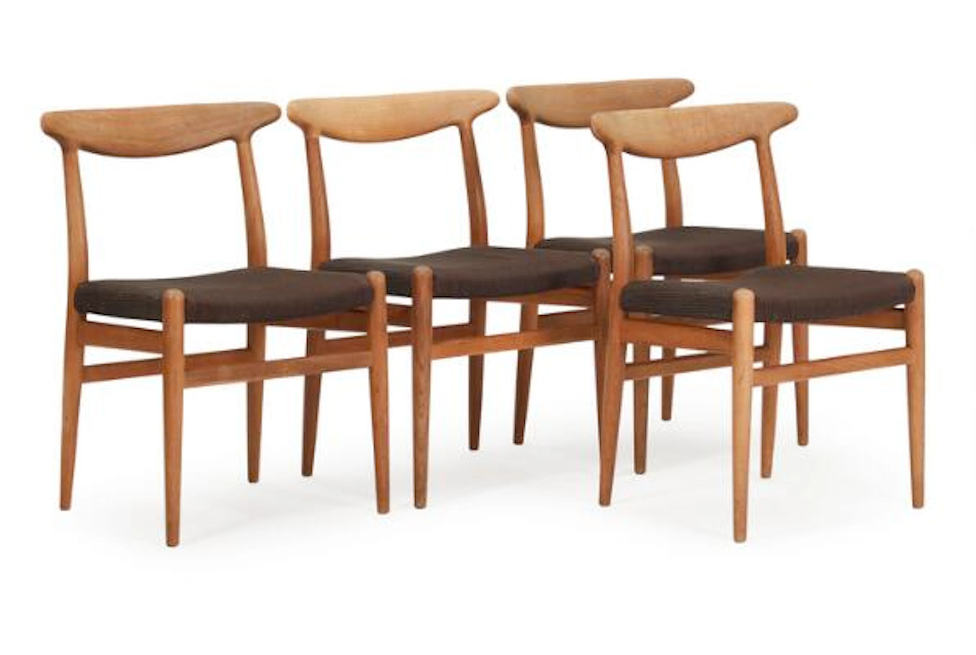 Hans J. Wegner: "W1". A set of four chairs with oak frame, upholstered