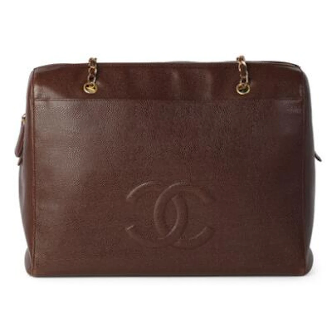 Chanel: A vintage tote bag of dark brown caviar leather with gold