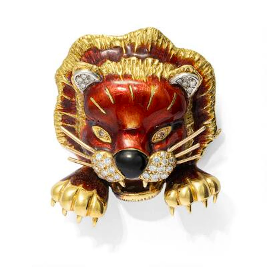 Kutchinsky: An enamel and diamond brooch in the shape of a lion head