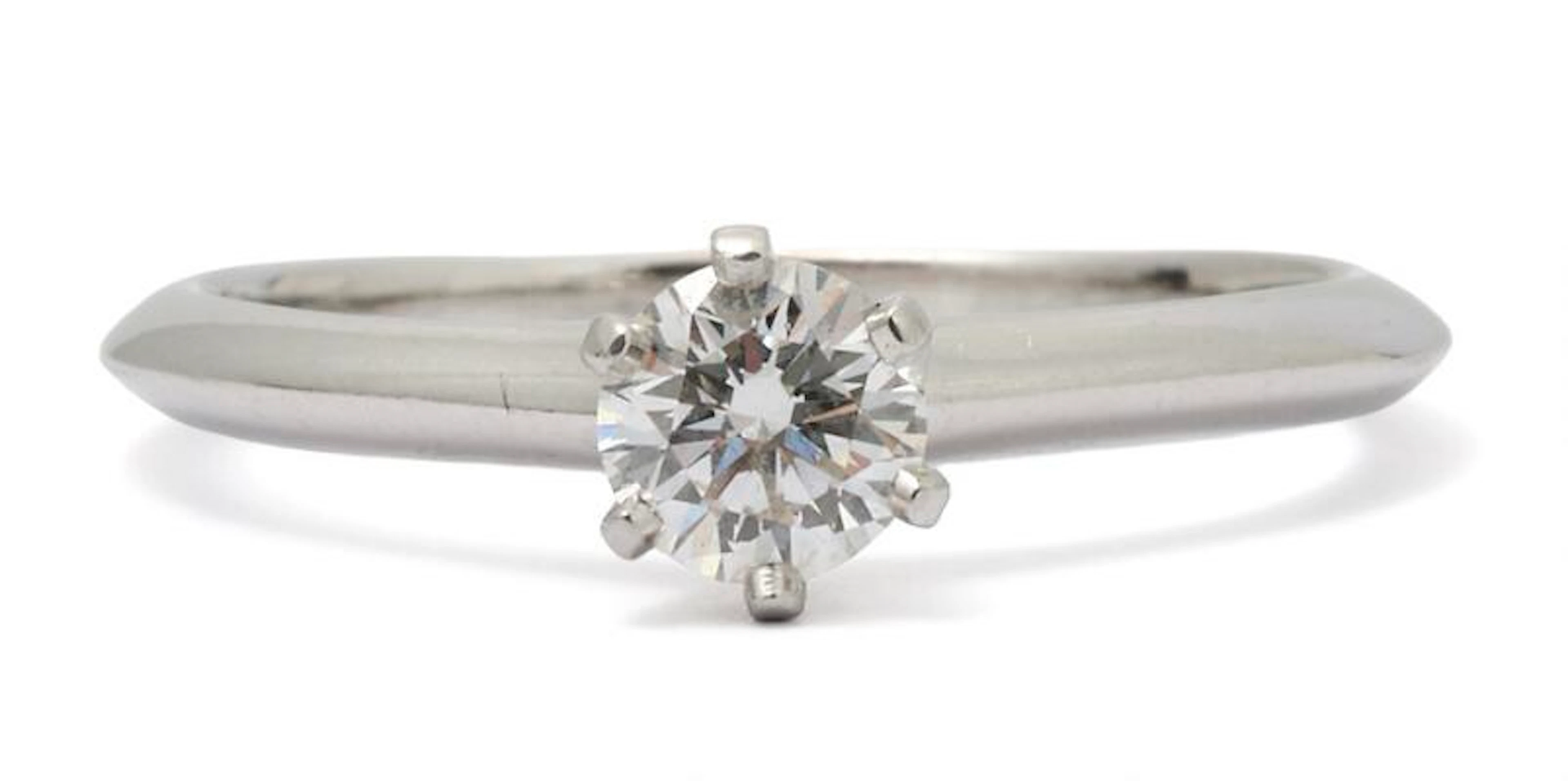 Tiffany & Co.: A "The Tiffany® Setting" solitaire diamond ring, mounted