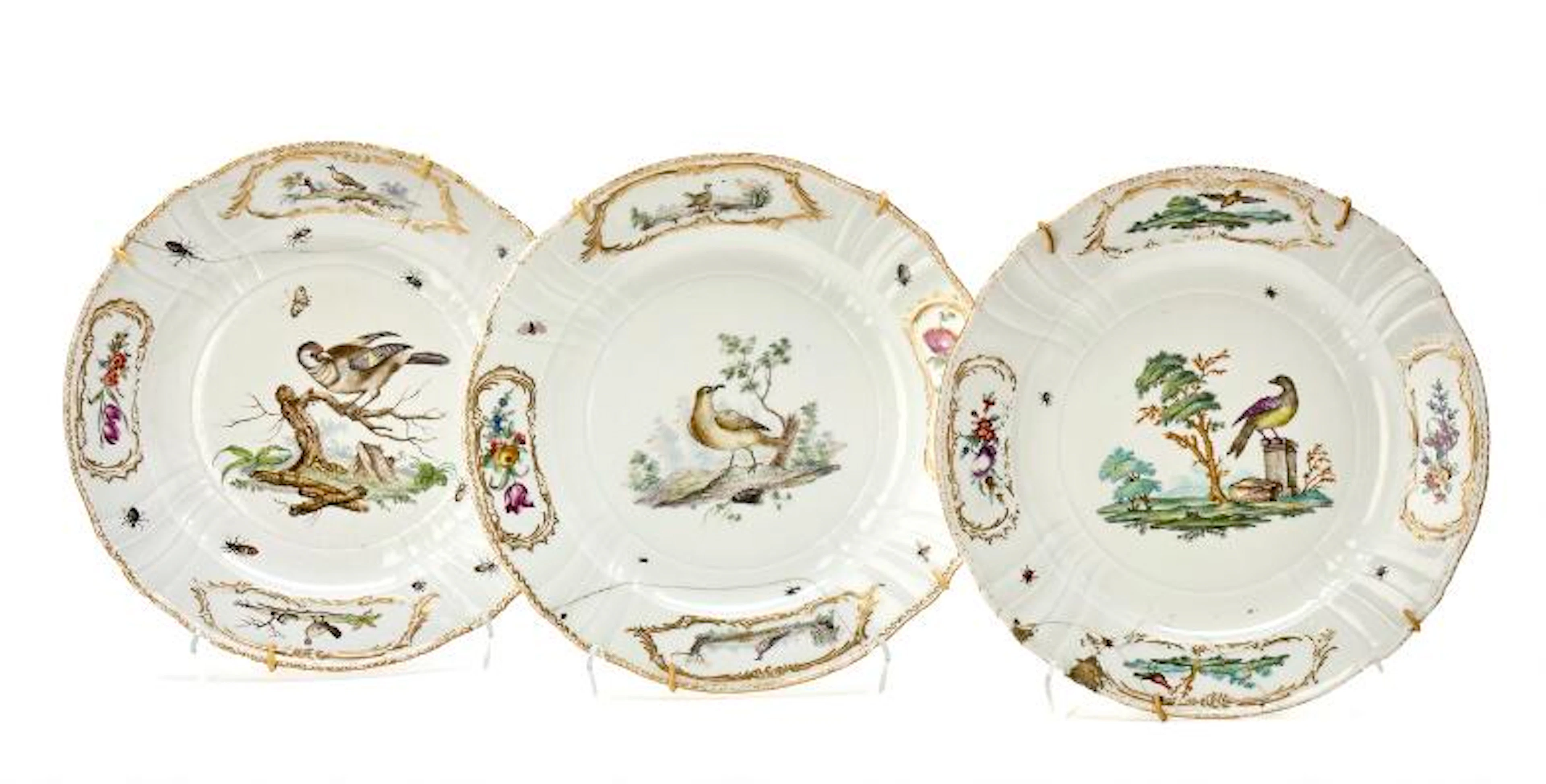 Fuglestellet' four porcelain plates, barbed rim model with cartouches