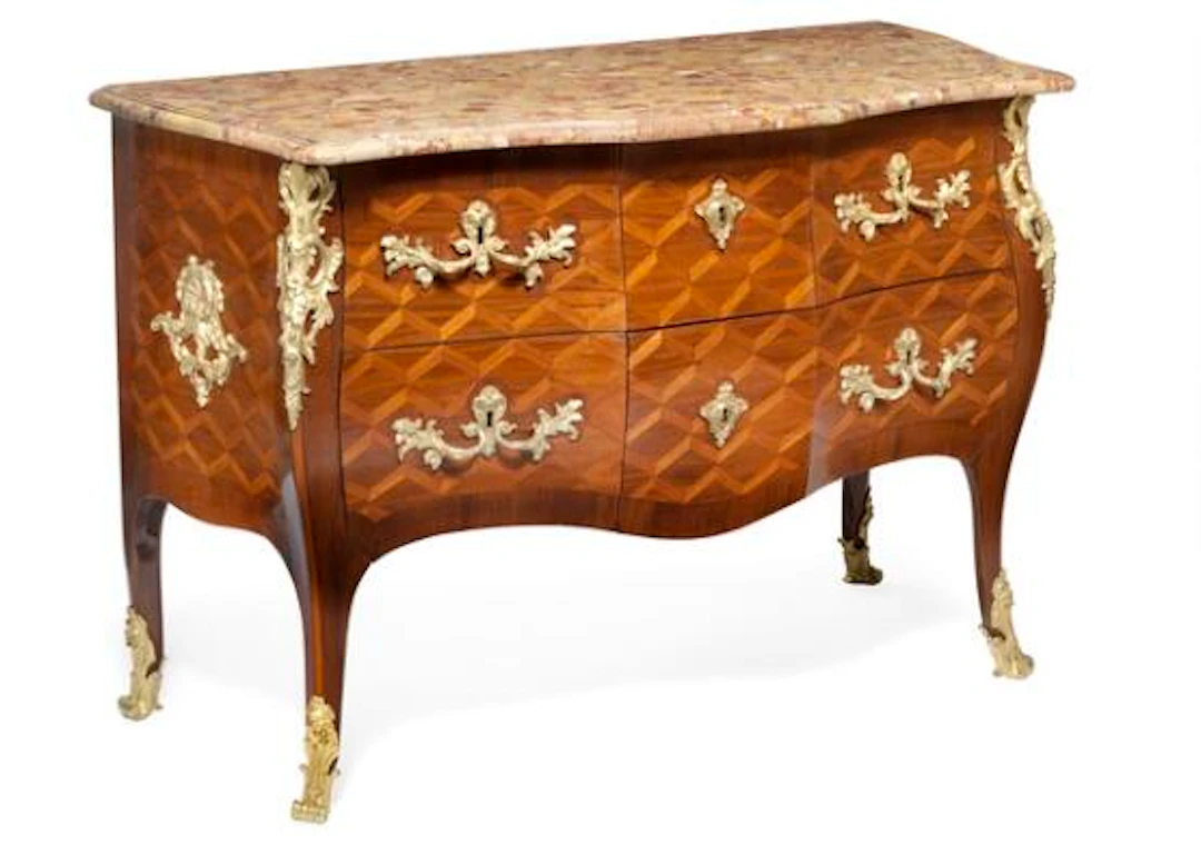 Jacques Dubois: A Louis XV gilt bronze mounted parquetry commode.