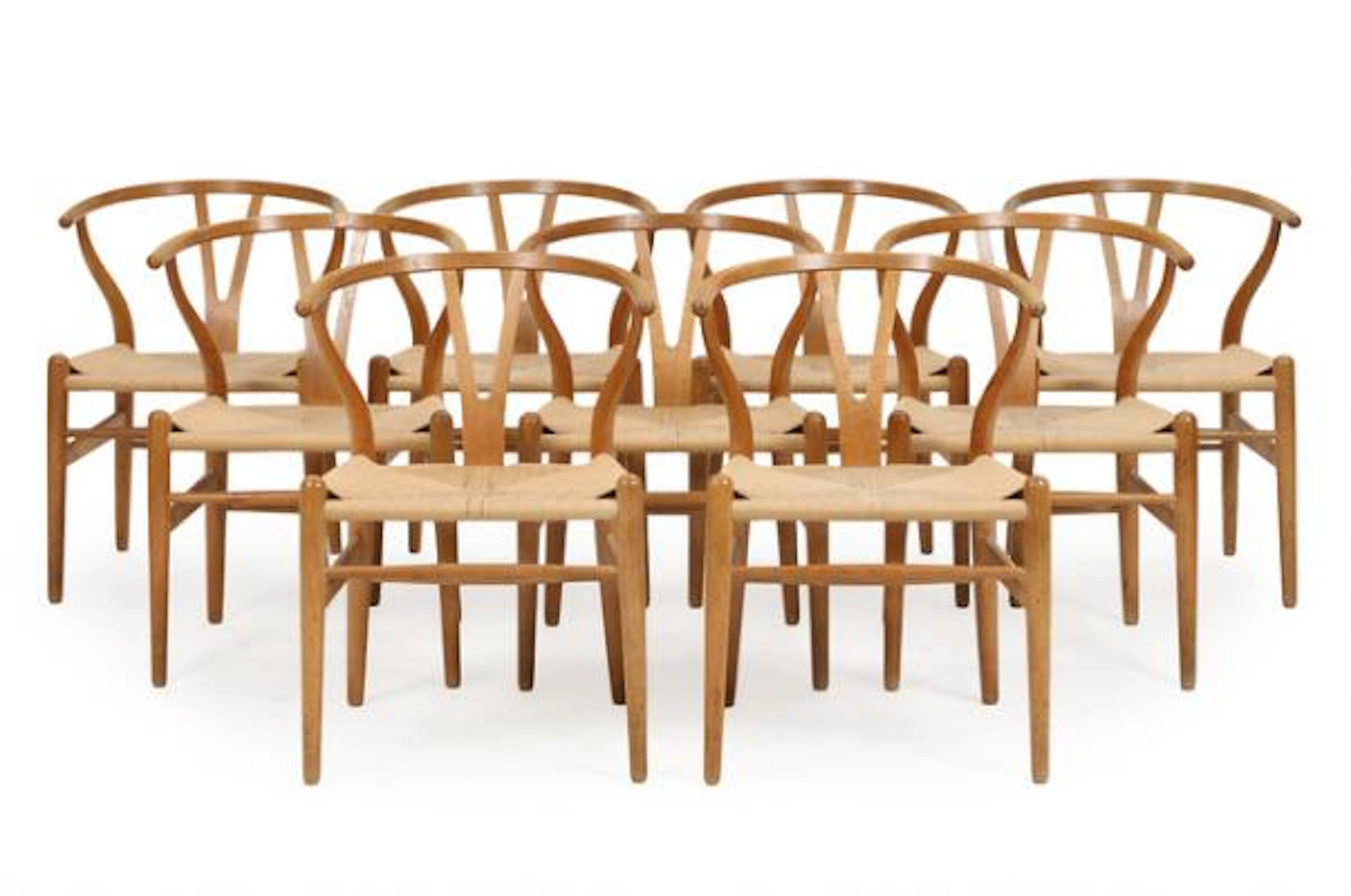 Hans J. Wegner: “Y-chair/The Wishbone Chair”. Set of nine patinated