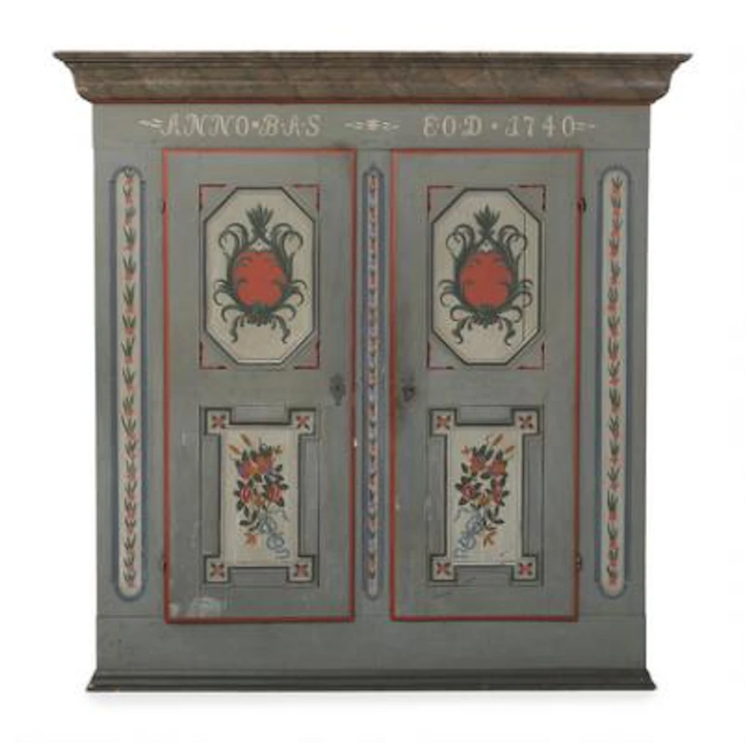 A Danish painted wooden folk cupboard. Mid-19th century. H. 187 cm.