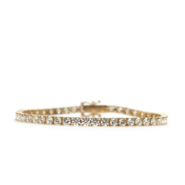A diamond tennis bracelet set with 50 brilliant-cut diamonds weighing