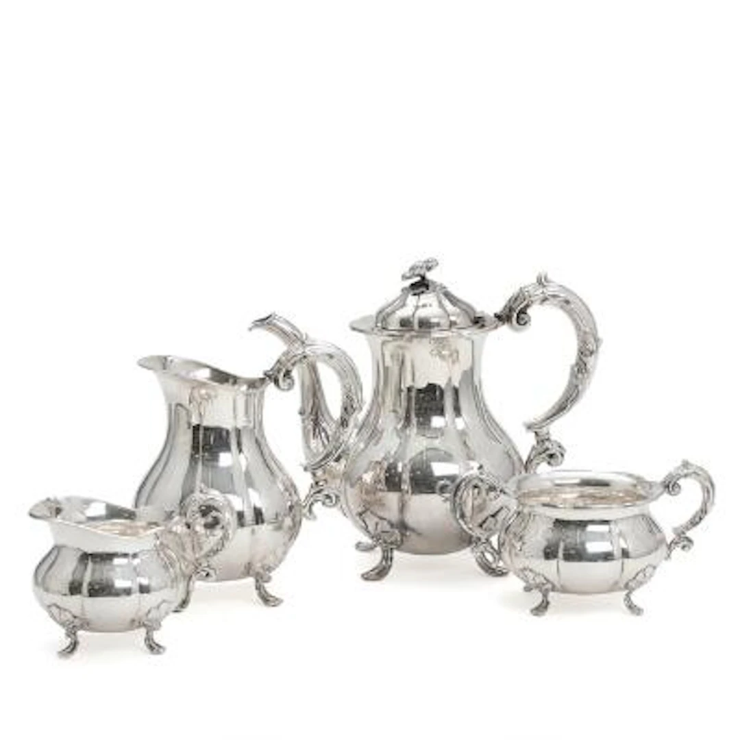A coffee set of silver comprising coffee pot, jug, creamer and sugar