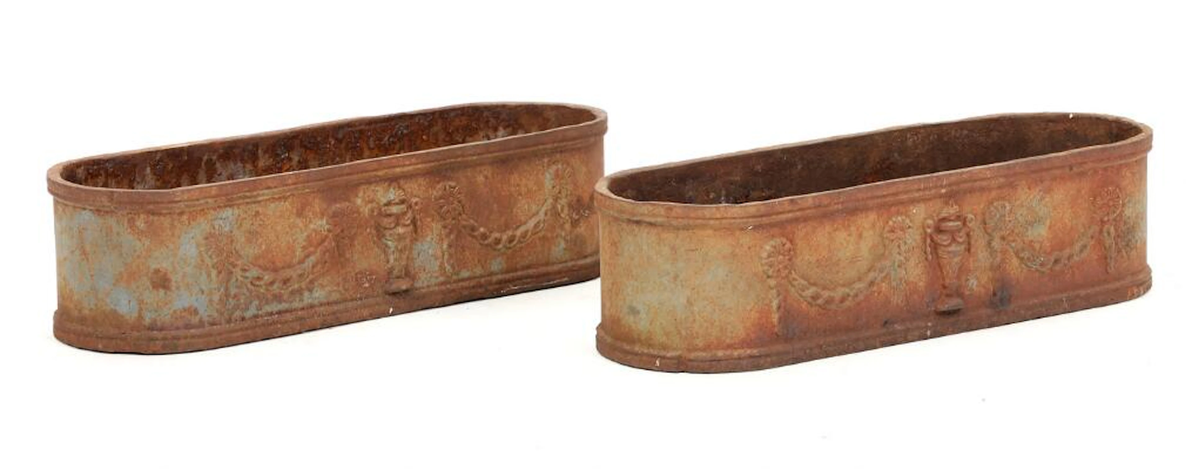 A pair of French cast iron flower troughs, decorated with ornamental