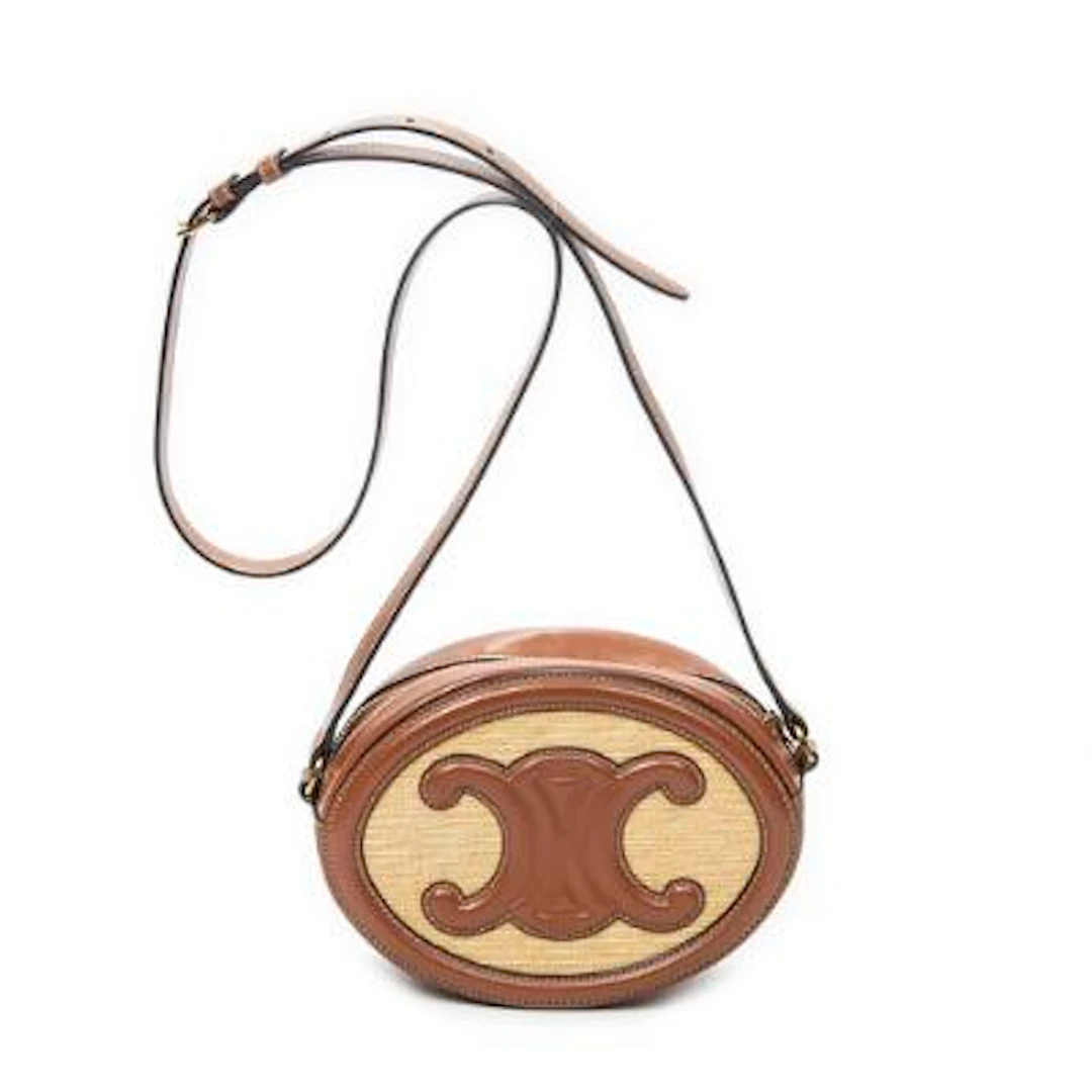 Celine: A "Triomphe Oval Crossbody" bag in partly brown leather and