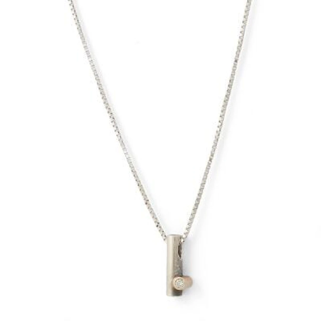 A diamond necklace and pendant set with a diamond, mounted in silver