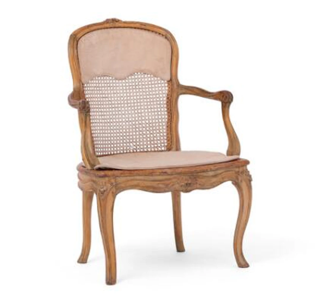 Rococo armchair of beech with woven back and seat, as well as two