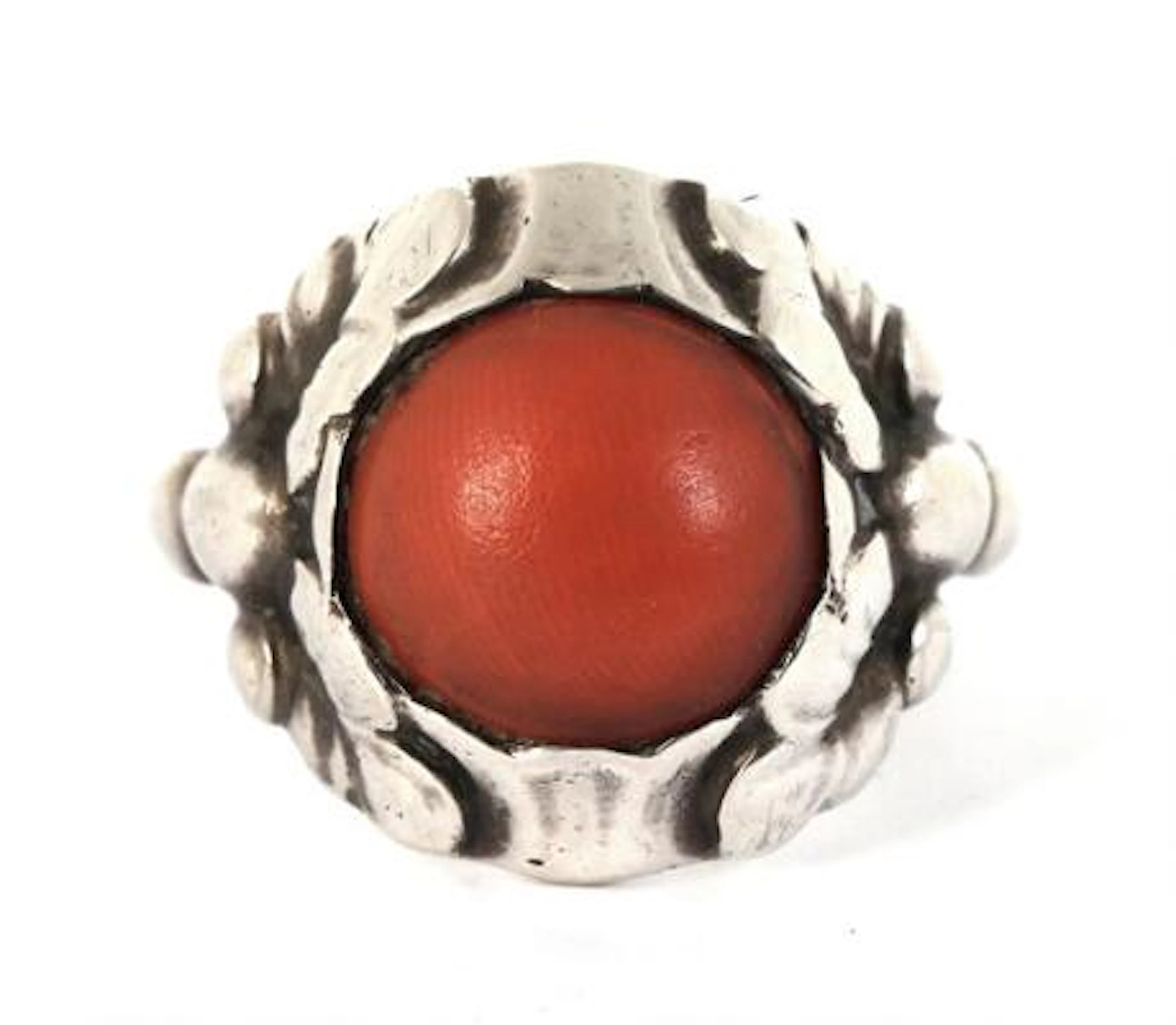Georg Jensen: A coral ring set with a cabochon coral, mounted in sterling