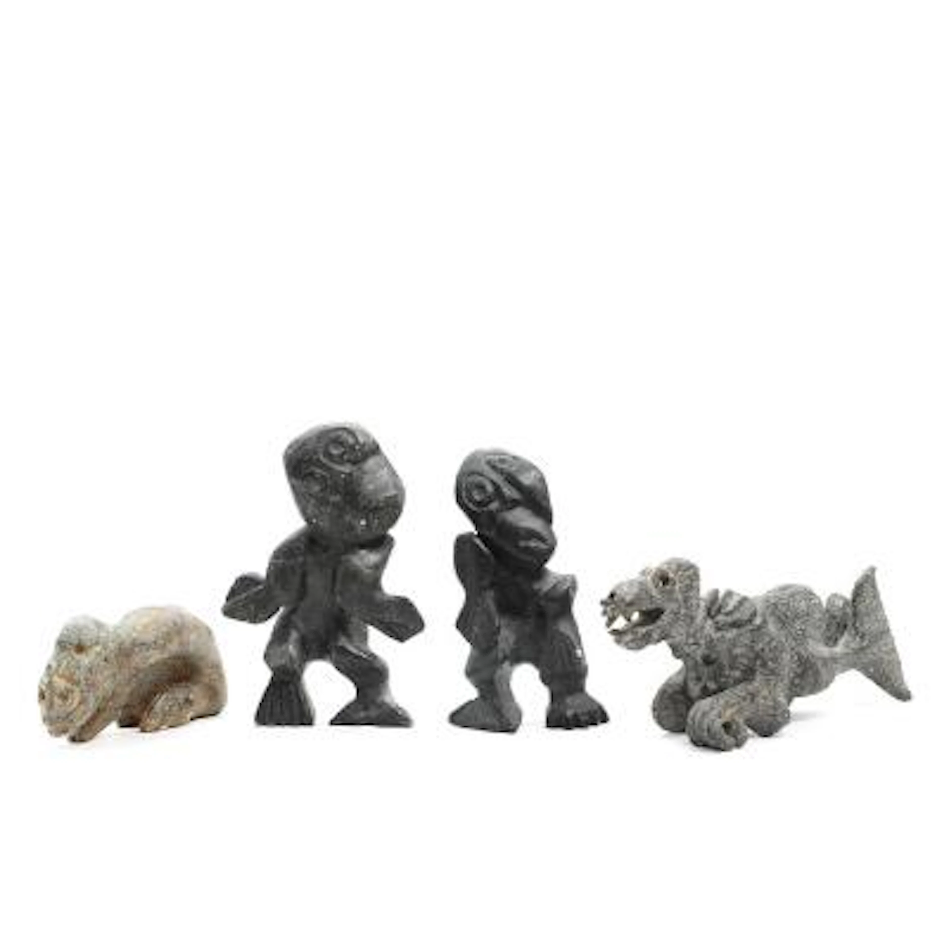 Greenlandic artists, 20th century.: Four tupilaks of soapstone. L.