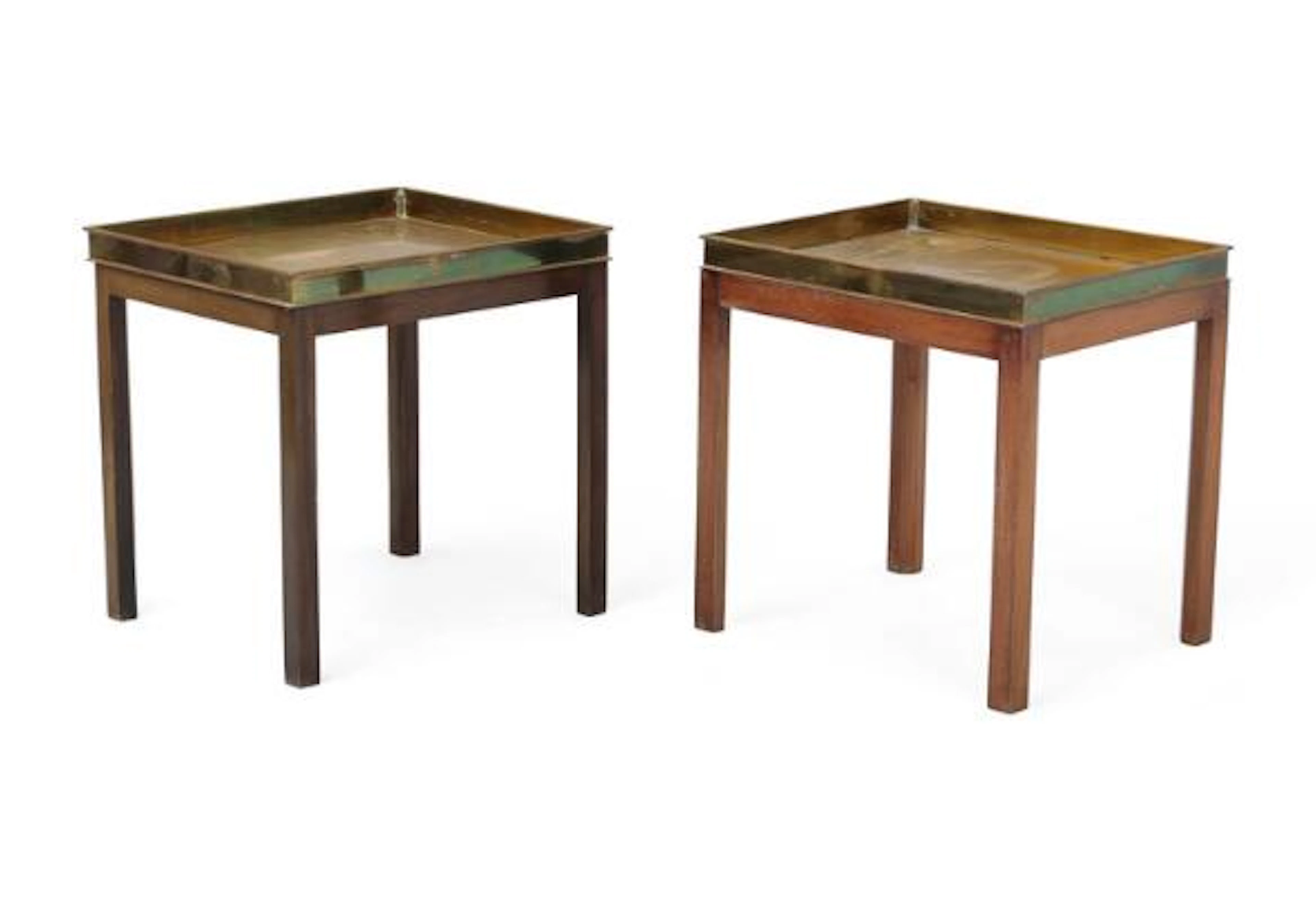 Danish cabinetmaker: A pair of mahogany tray tables with brass trays.