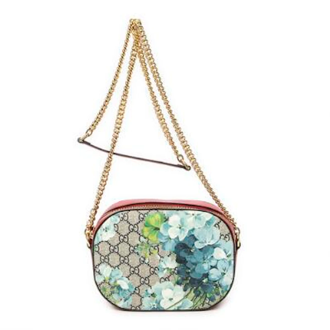 Gucci: A "Chain Camera Crossbody" bag in floral monogram coated canvas