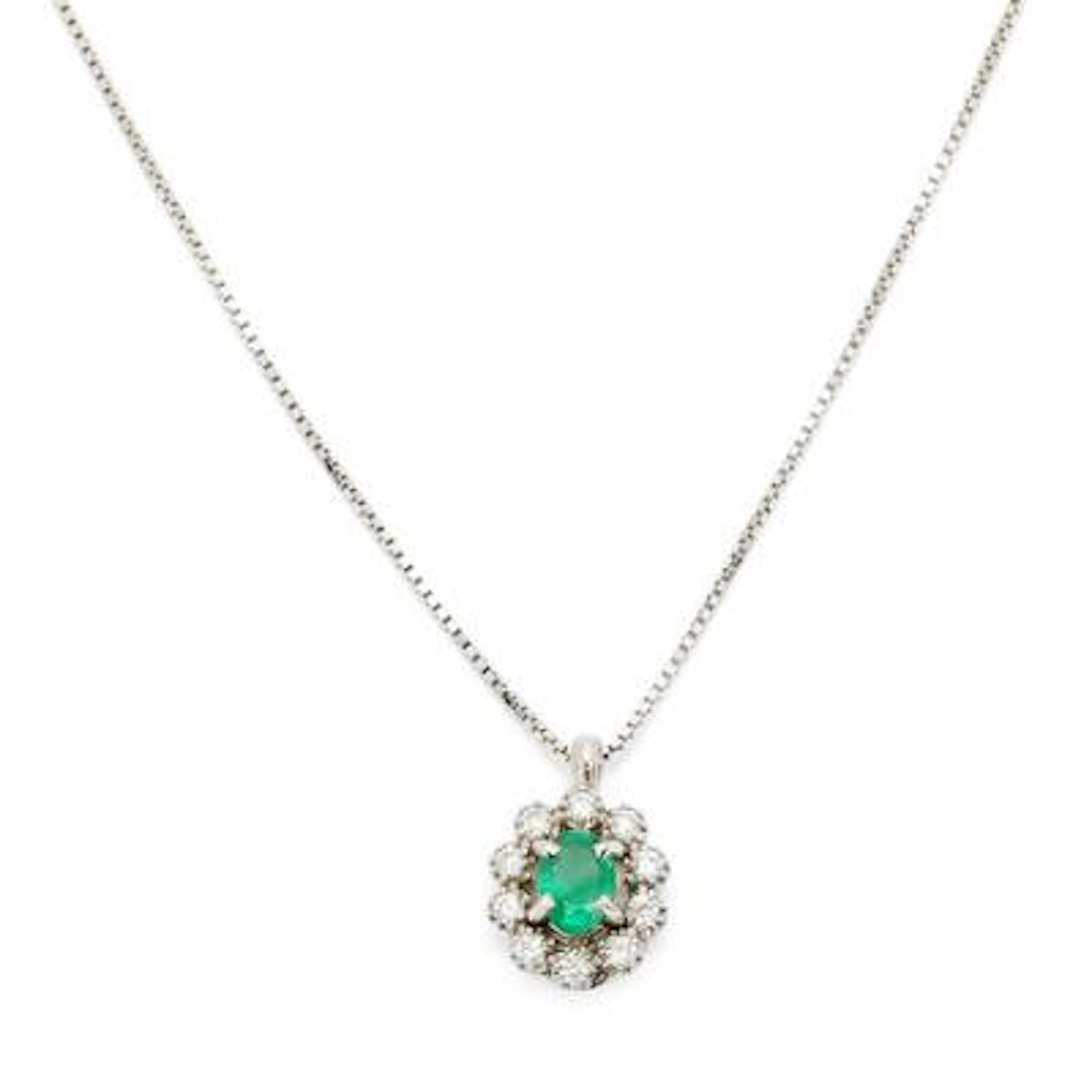 An emerald- and diamond pendant of 18k white gold. With necklace of