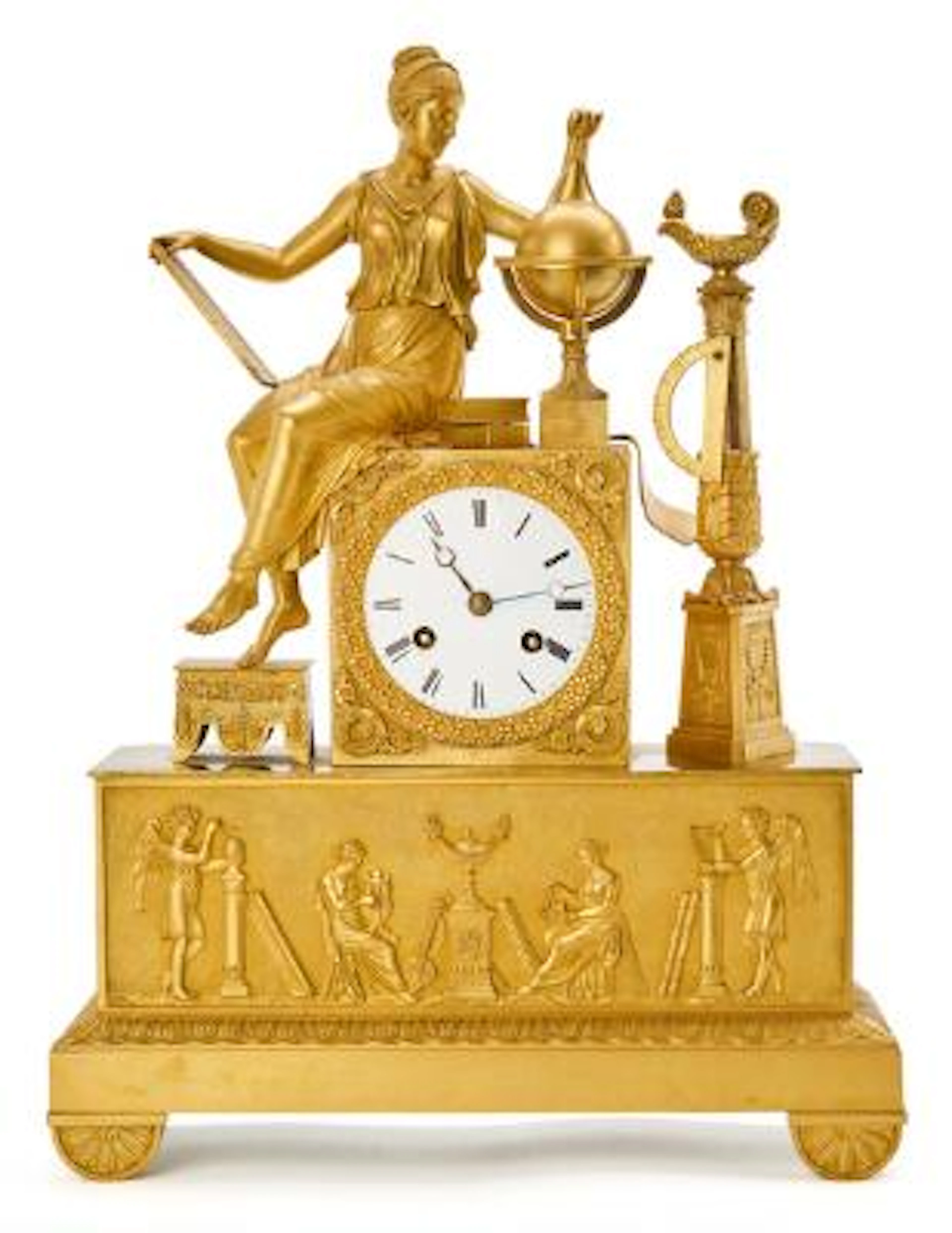 A French Empire mantel clock of gilded bronze. Early 19th century.