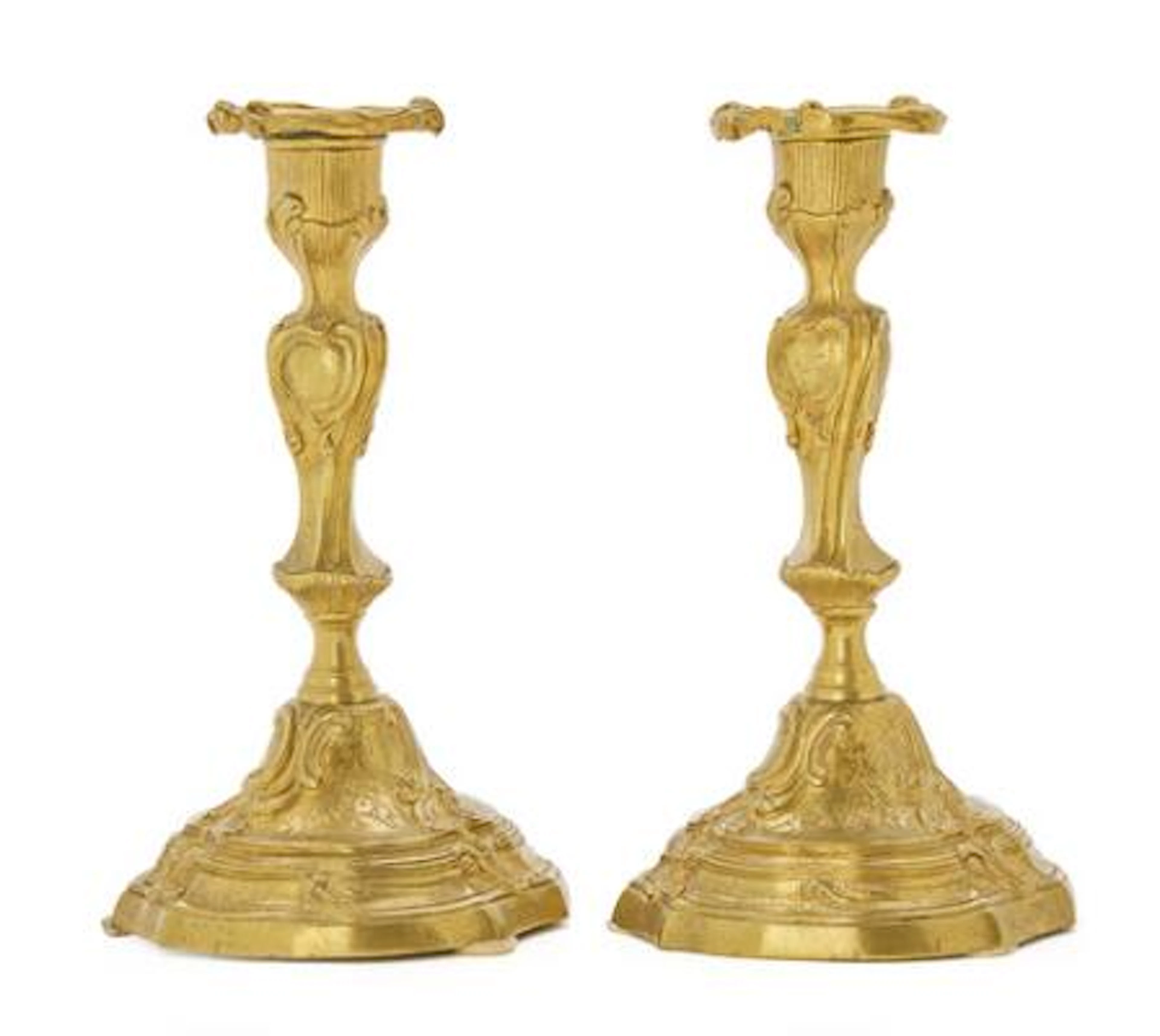 A pair of French Napoleon III candlesticks in gilt bronze, 19th century.