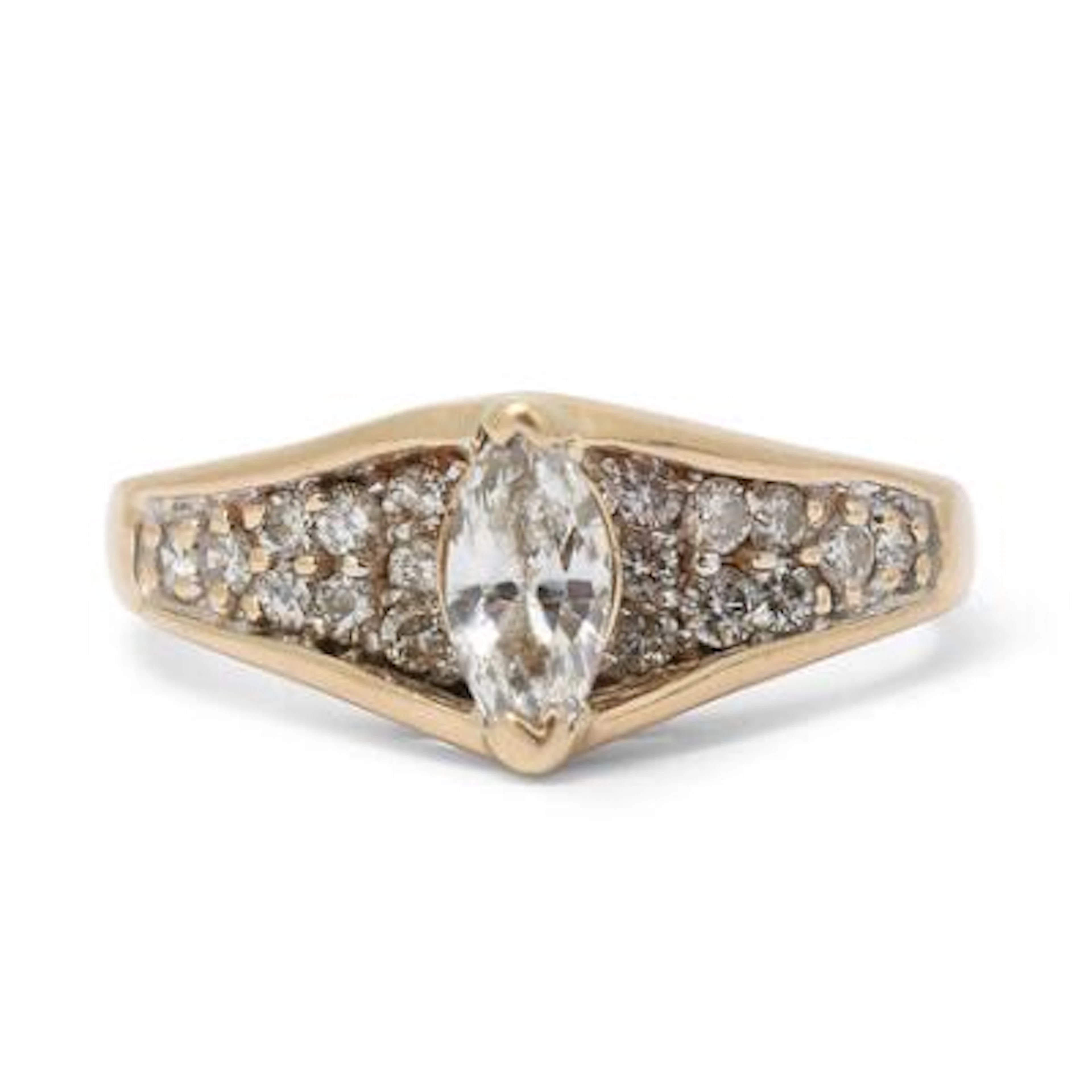 A diamond ring set with a marquise-cut diamond encircled by diamonds