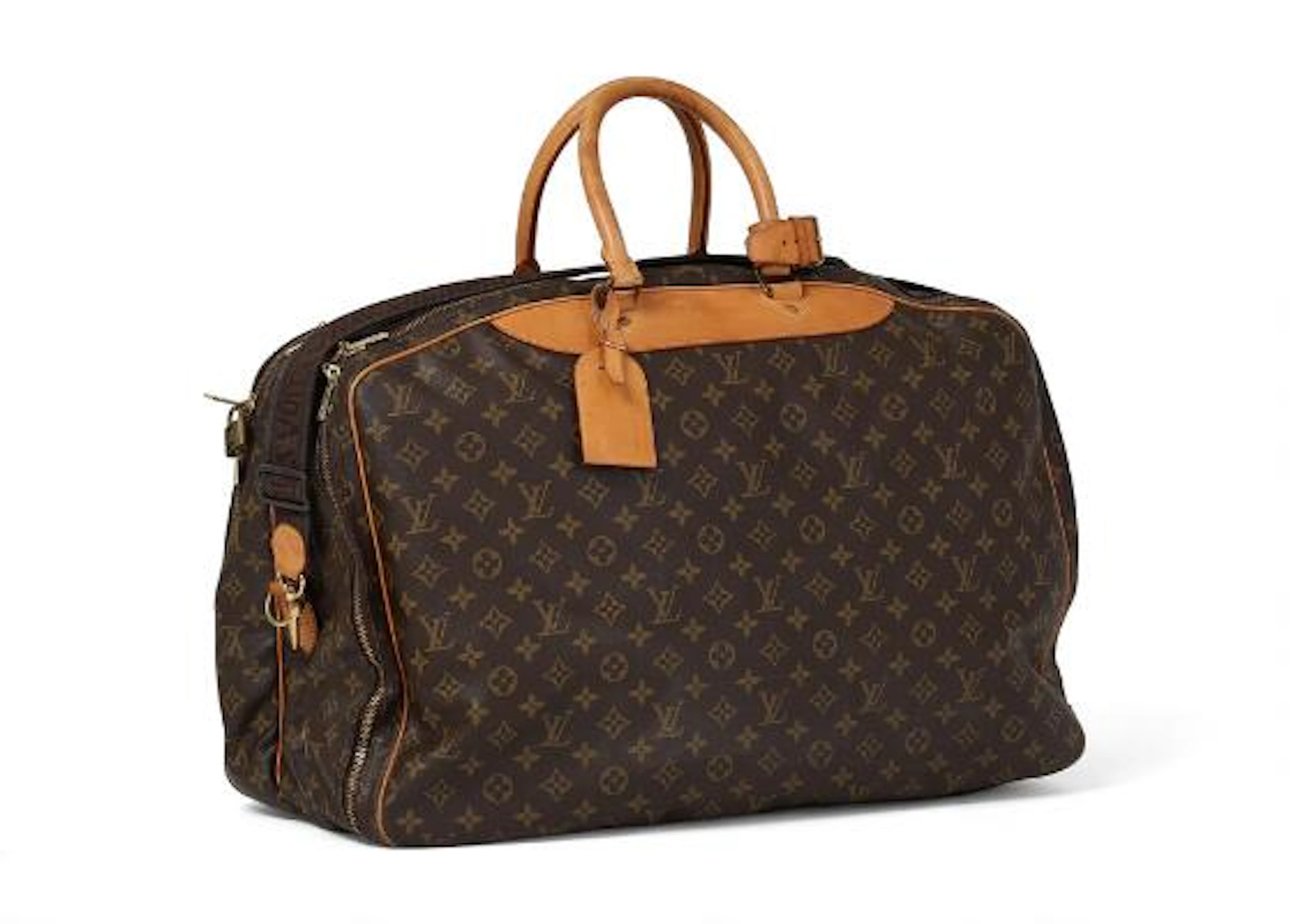 Louis Vuitton: An "Alizé" travel bag in brown monogram coated canvas