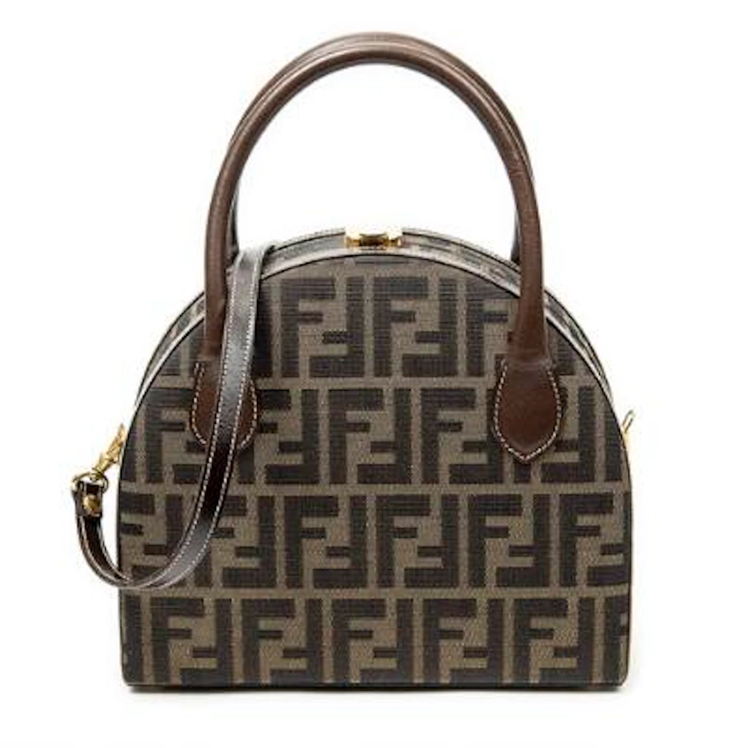 Fendi: A "Vintage Half Moon Vanity Bag" in brown monogram Zucca-canvas