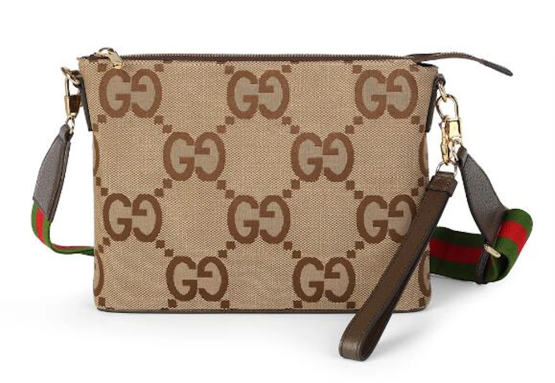 Gucci: A "Jumbo GG Pouch" of brown monogram canvas with brown leather