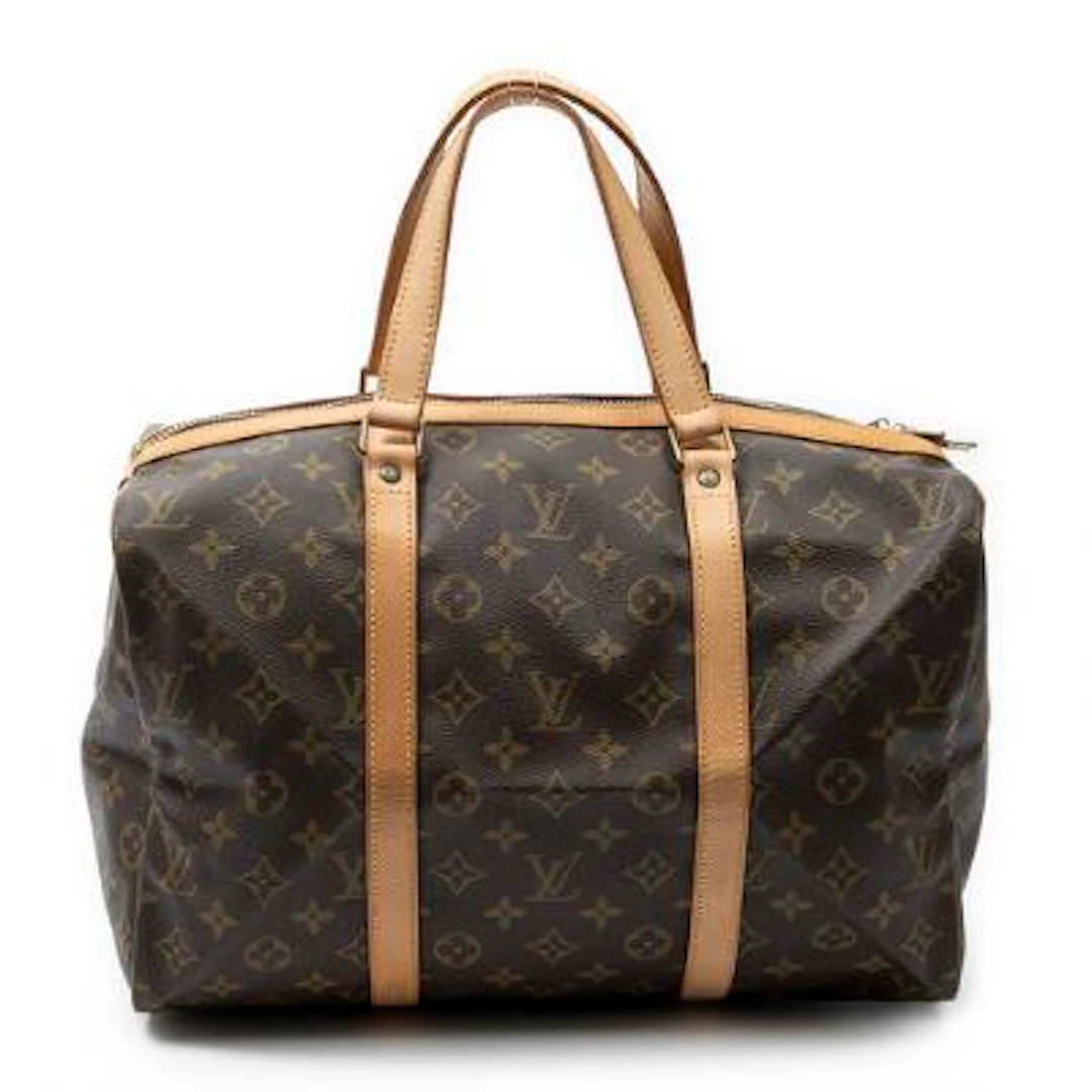 Louis Vuitton: A "Sac Souple 35" bag in brown monogram coated canvas