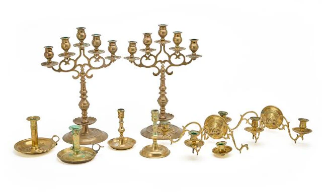 A pair of five-armed candelabra in bronze, a pair of wall lights and