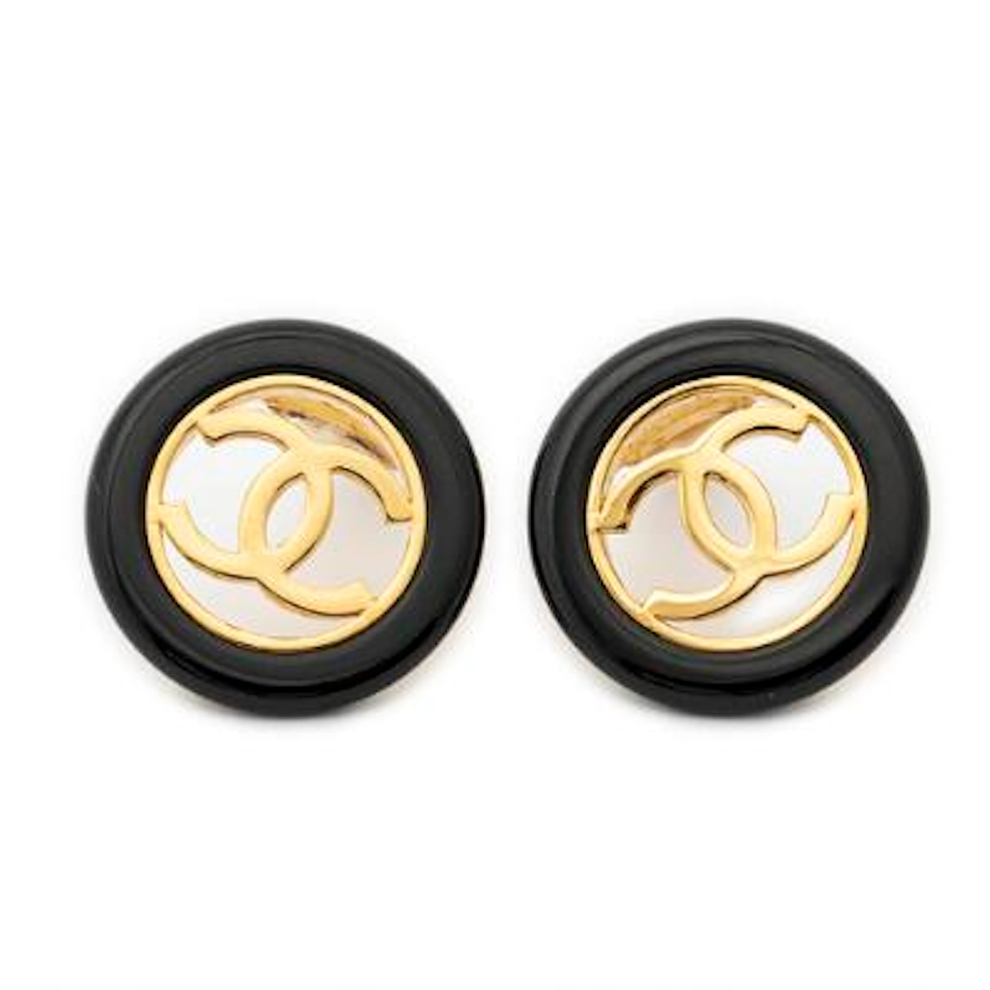 Chanel: A pair of ear clips of gold-tone metal and black enamel. L.