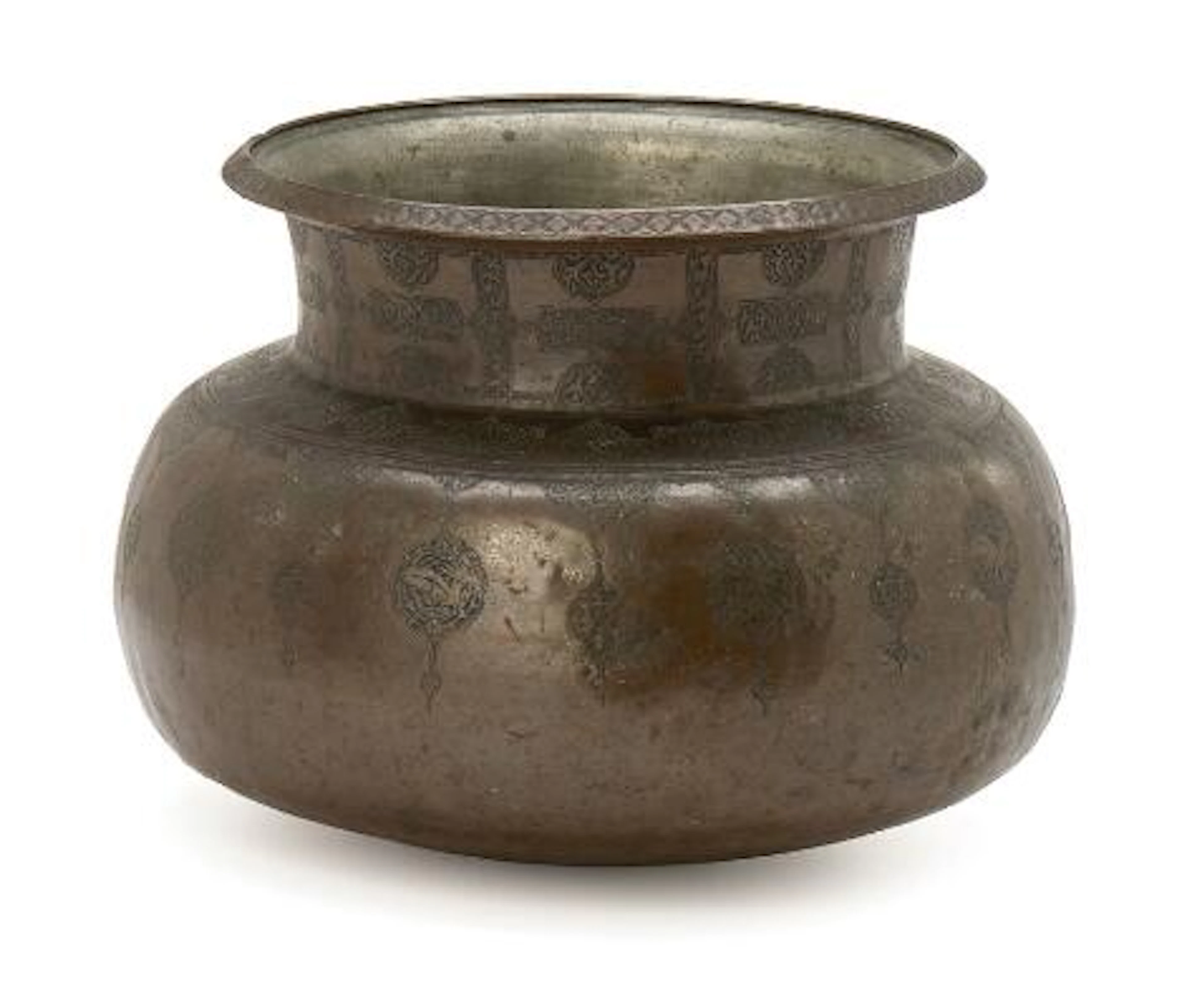 A tinned copper bowl imbossed with design, inside a Hebrew insciption.