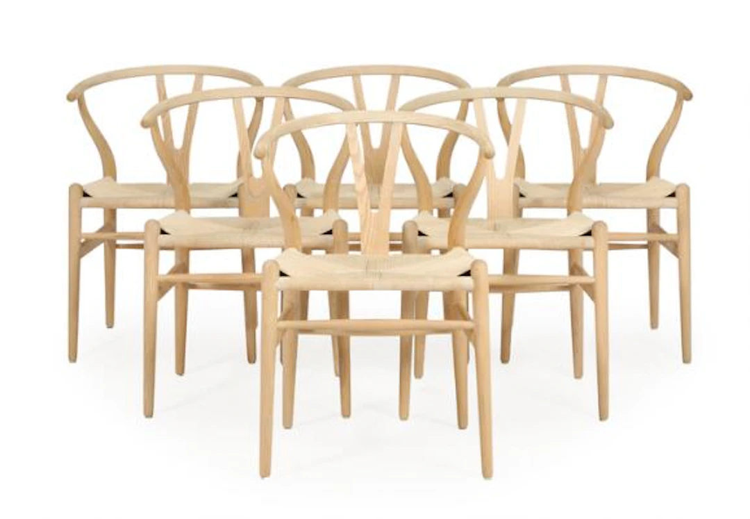 Hans J. Wegner: “The Wishbone Chair”. Set of six ash armchairs with