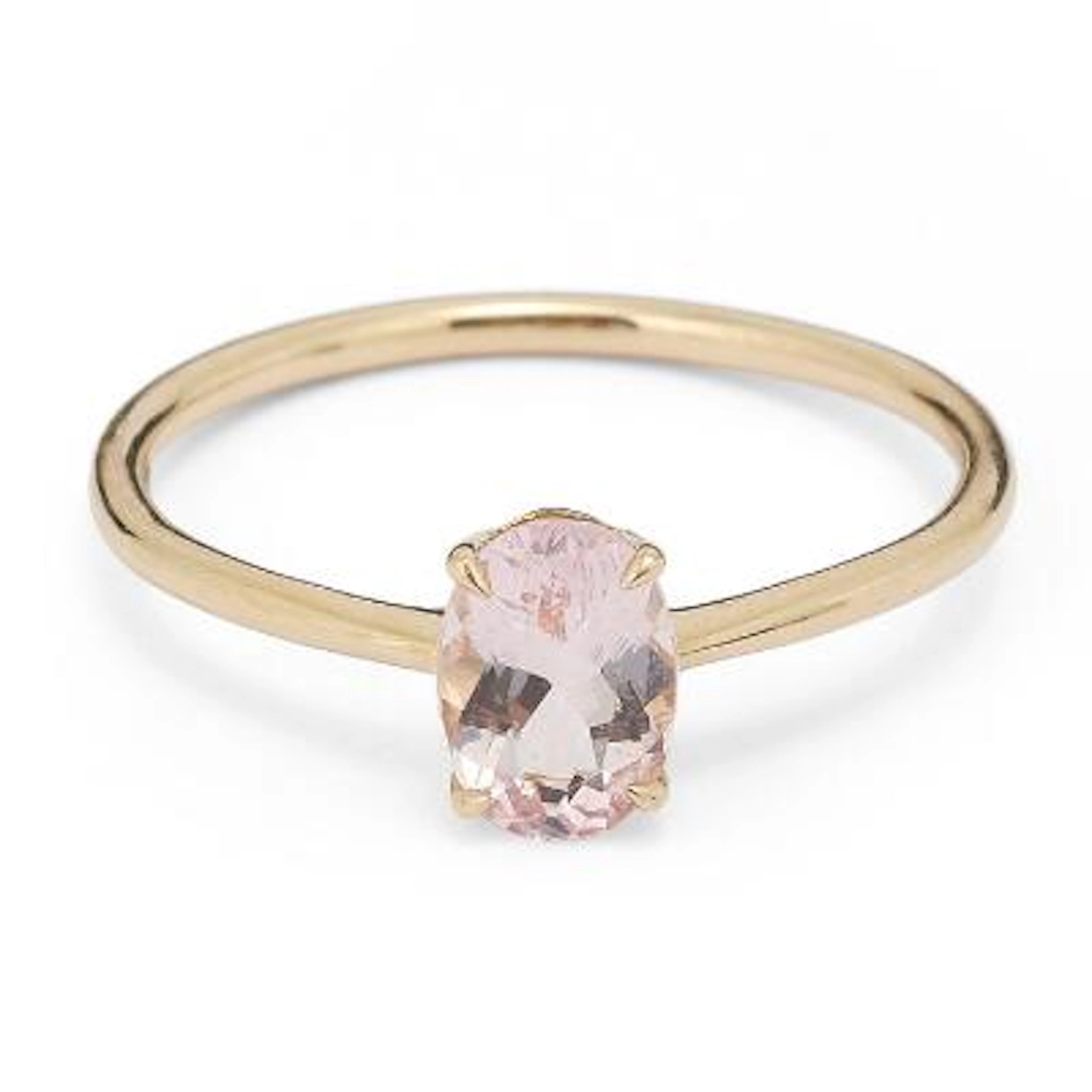 A morganite ring set with an oval-cut morganite mounted in 14k gold.