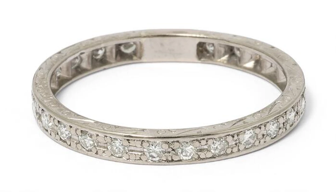 An eternity diamond ring set with numerous brilliant-cut diamonds