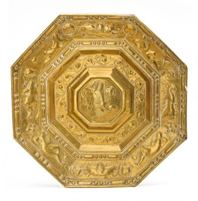 A probably Swedish mid-17th century Baroque brass light shield. 64