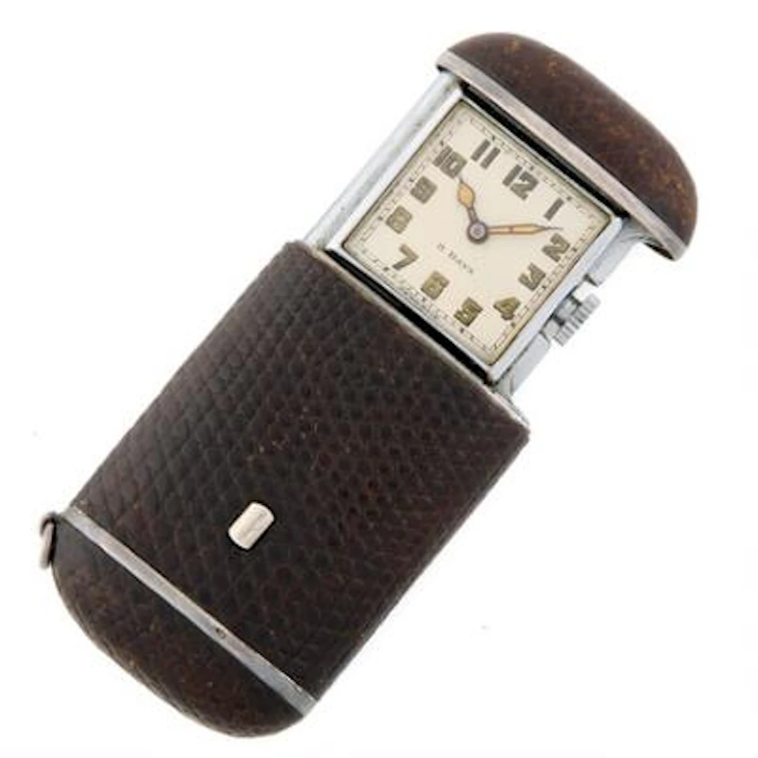 Folding watch of steel and silver clad with reptile skin. Manually
