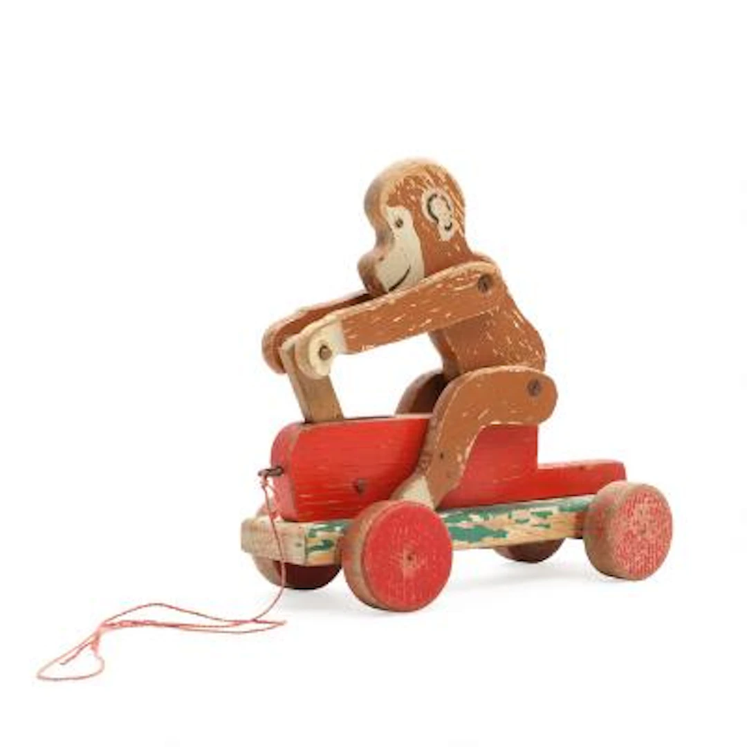 LEGO: A semi mechanical painted beech monkey on trolley/dandy horse.