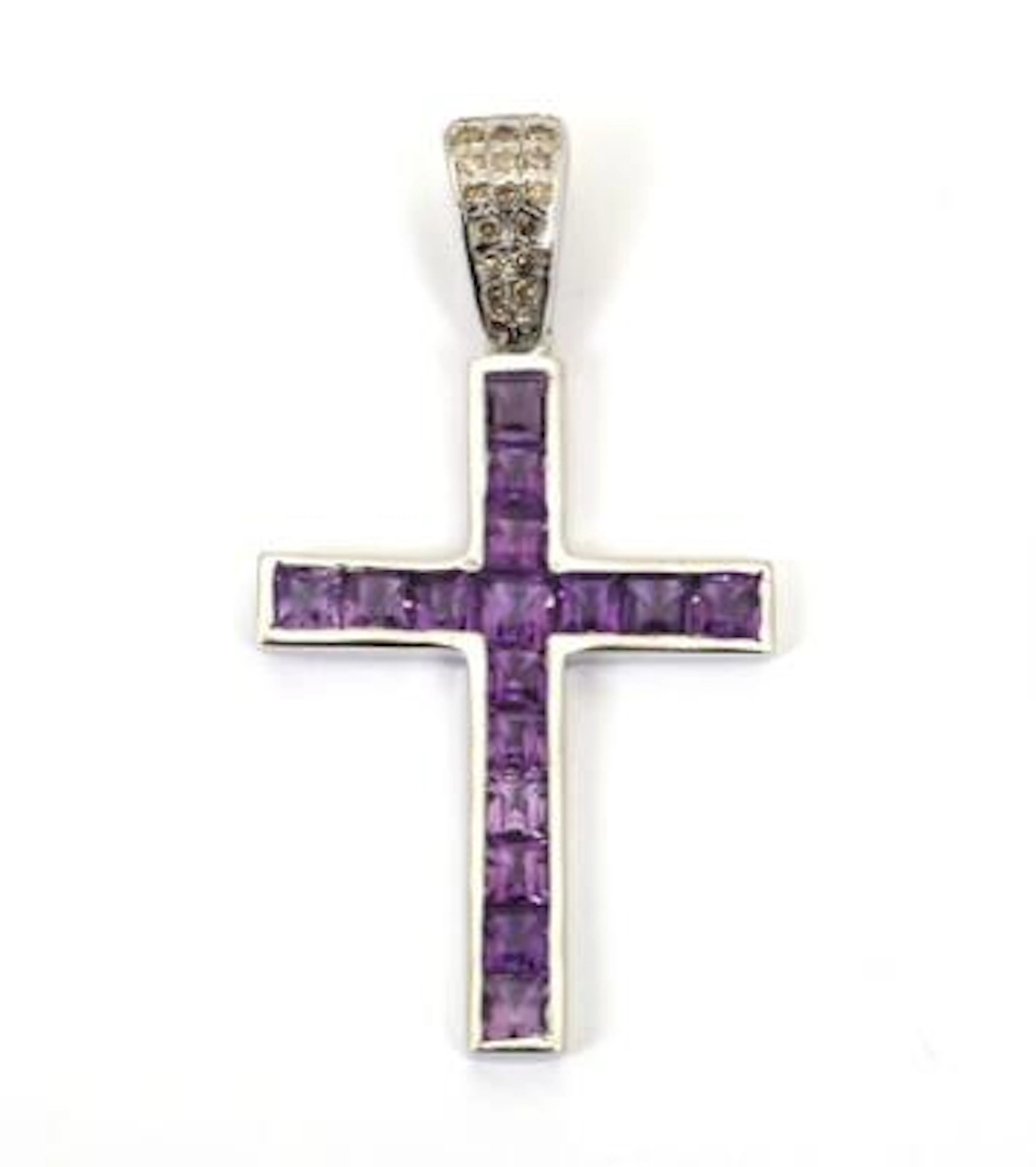 An amethyst pendant in the shape of a cross set with numerous fancy-cut