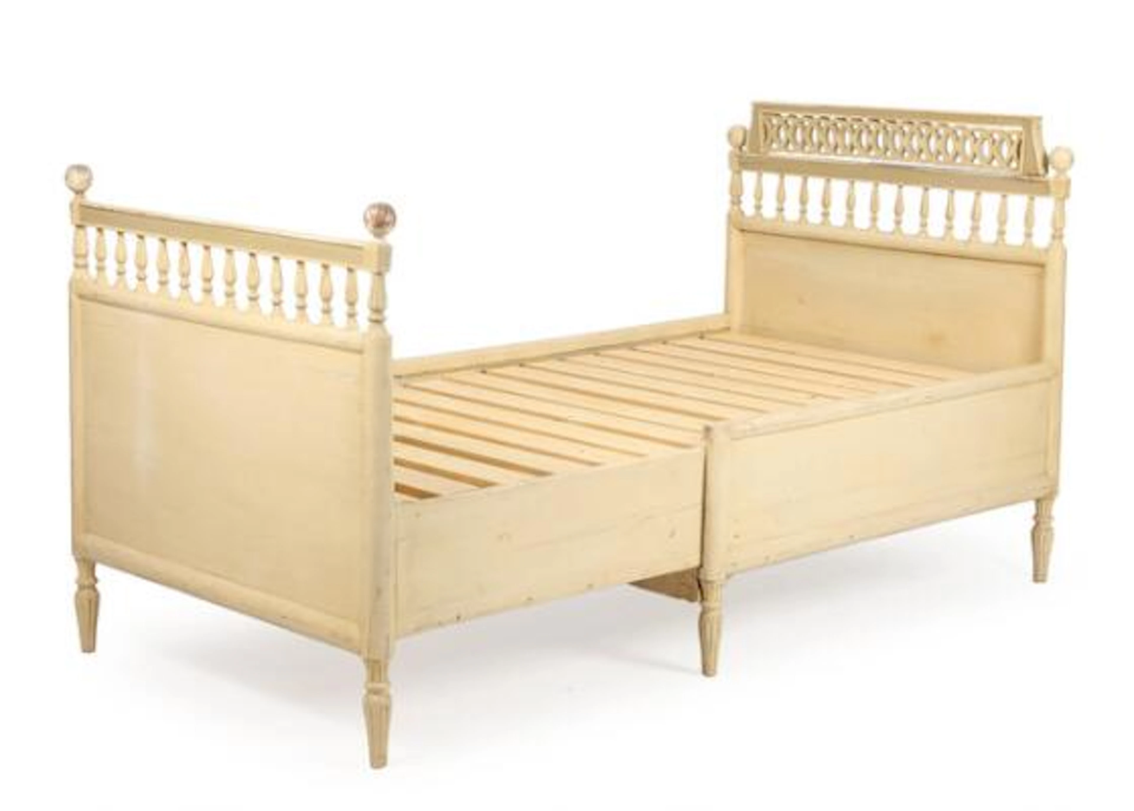 Extension bed of carved and painted wood. Gustavian form. C. 1900.