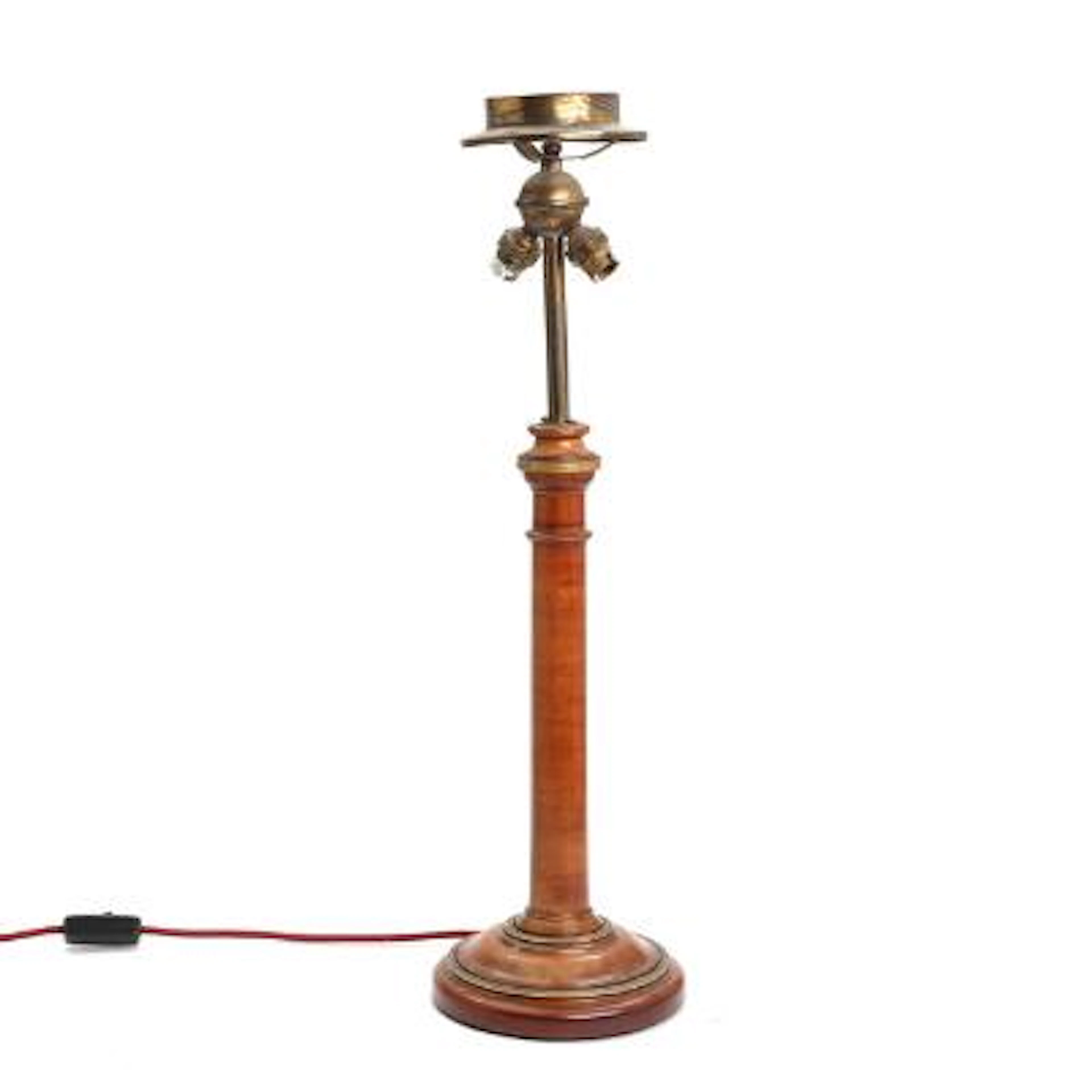 Table lamp of turned wood, adorned with bronze fittings. C. 1900.