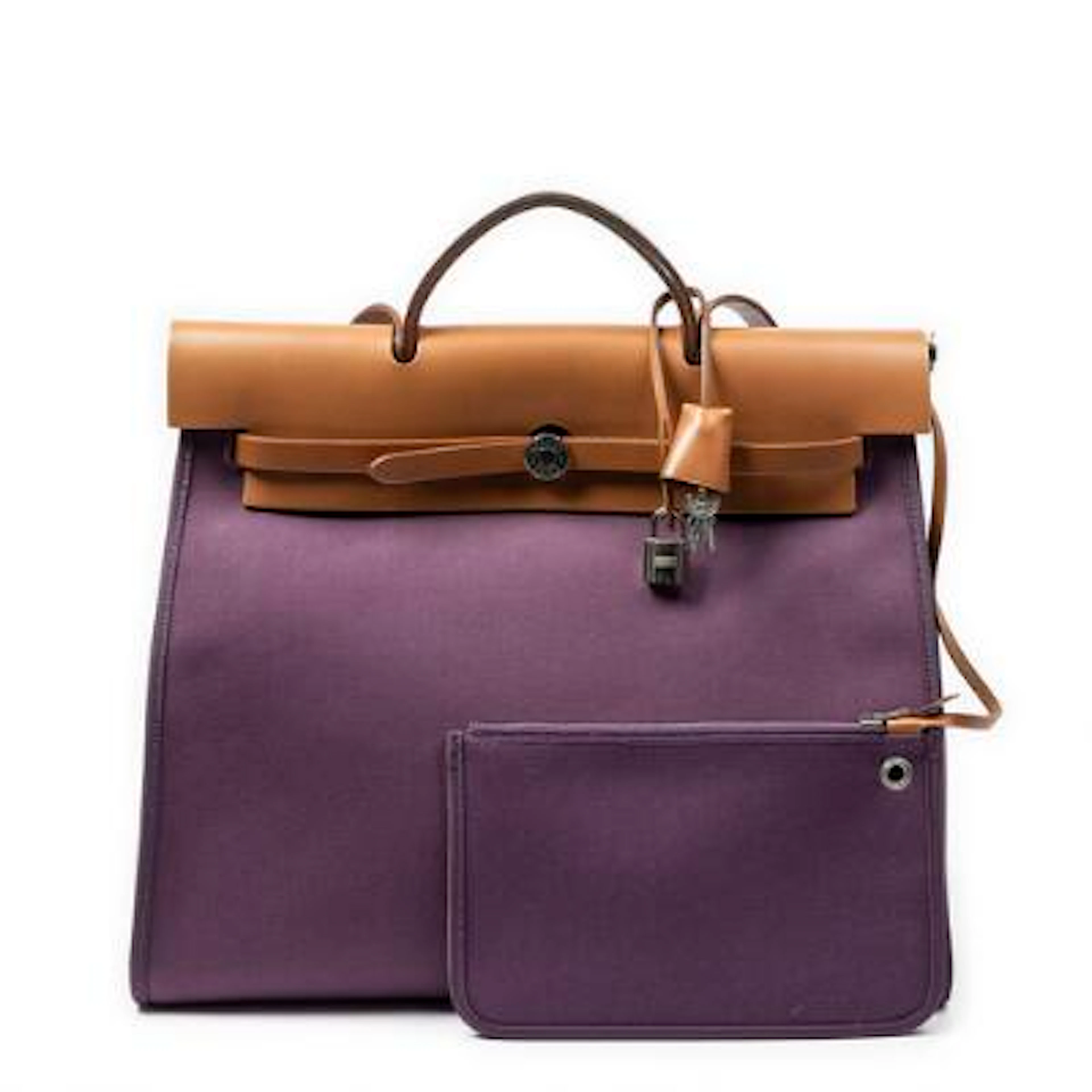 Hermès: A "Herbag" of brown leather and purple canvas with palladium