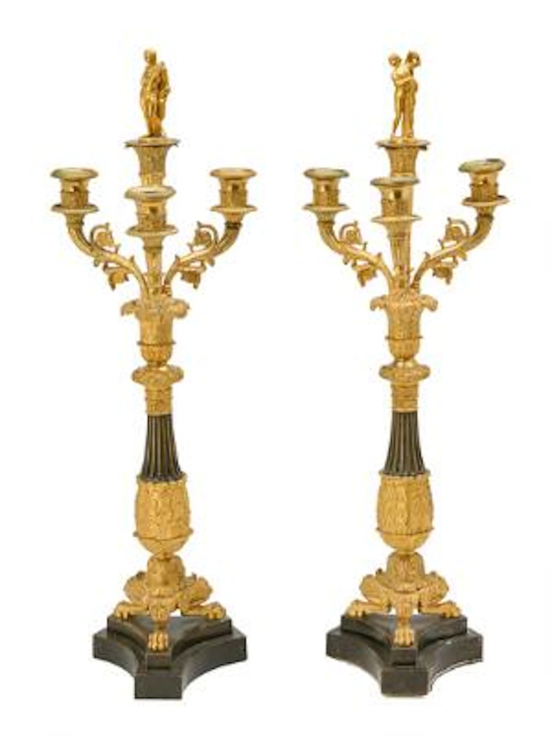 A pair of Charles X candelabra in gilt and partially patinated bronze.
