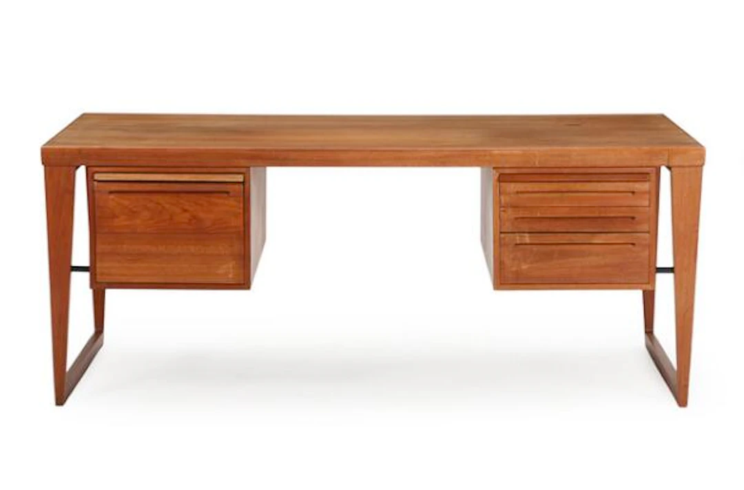 Kai Kristiansen: A freestanding teak desk on runner legs with six