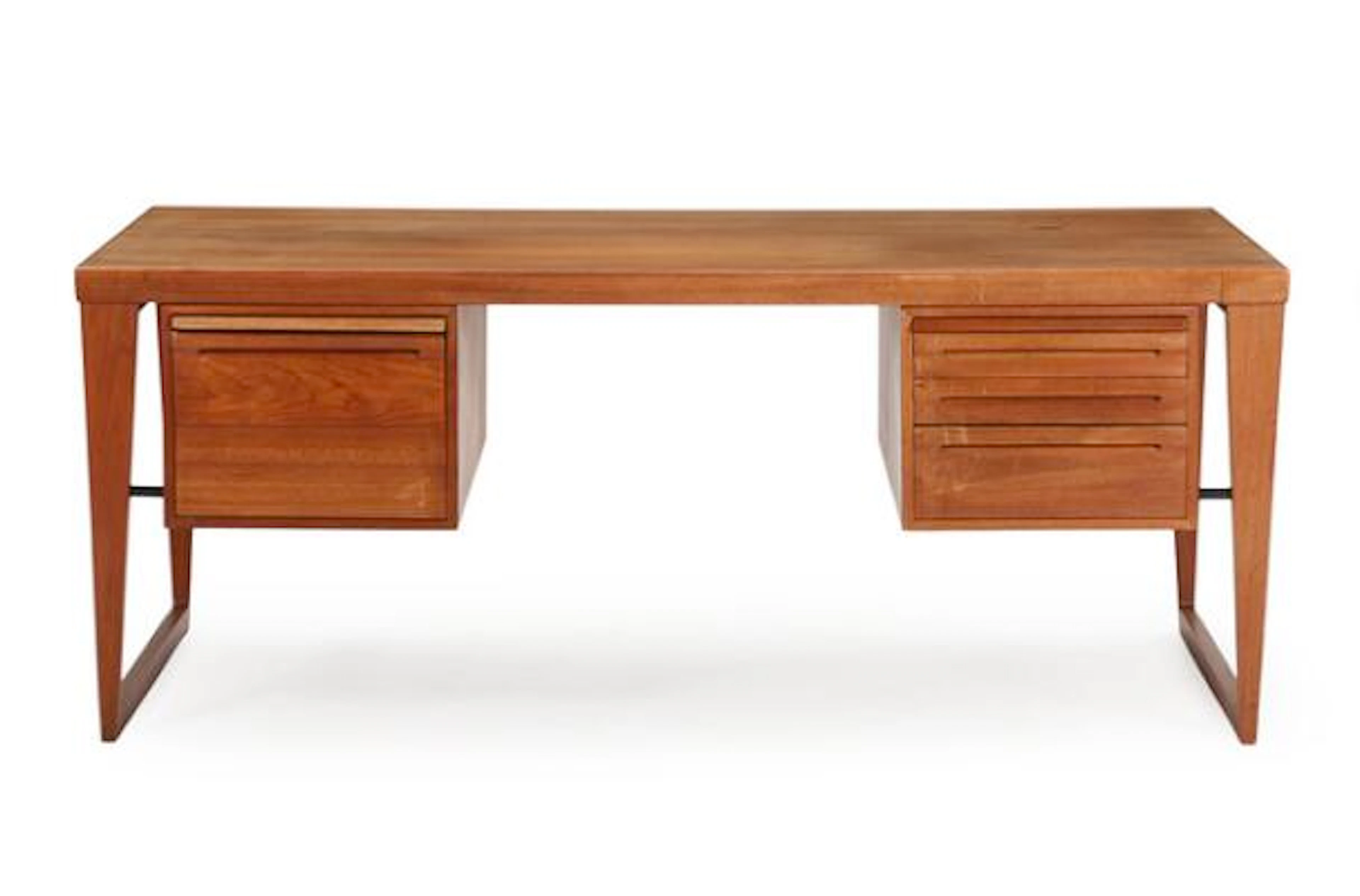 Kai Kristiansen: A freestanding teak desk on runner legs with six