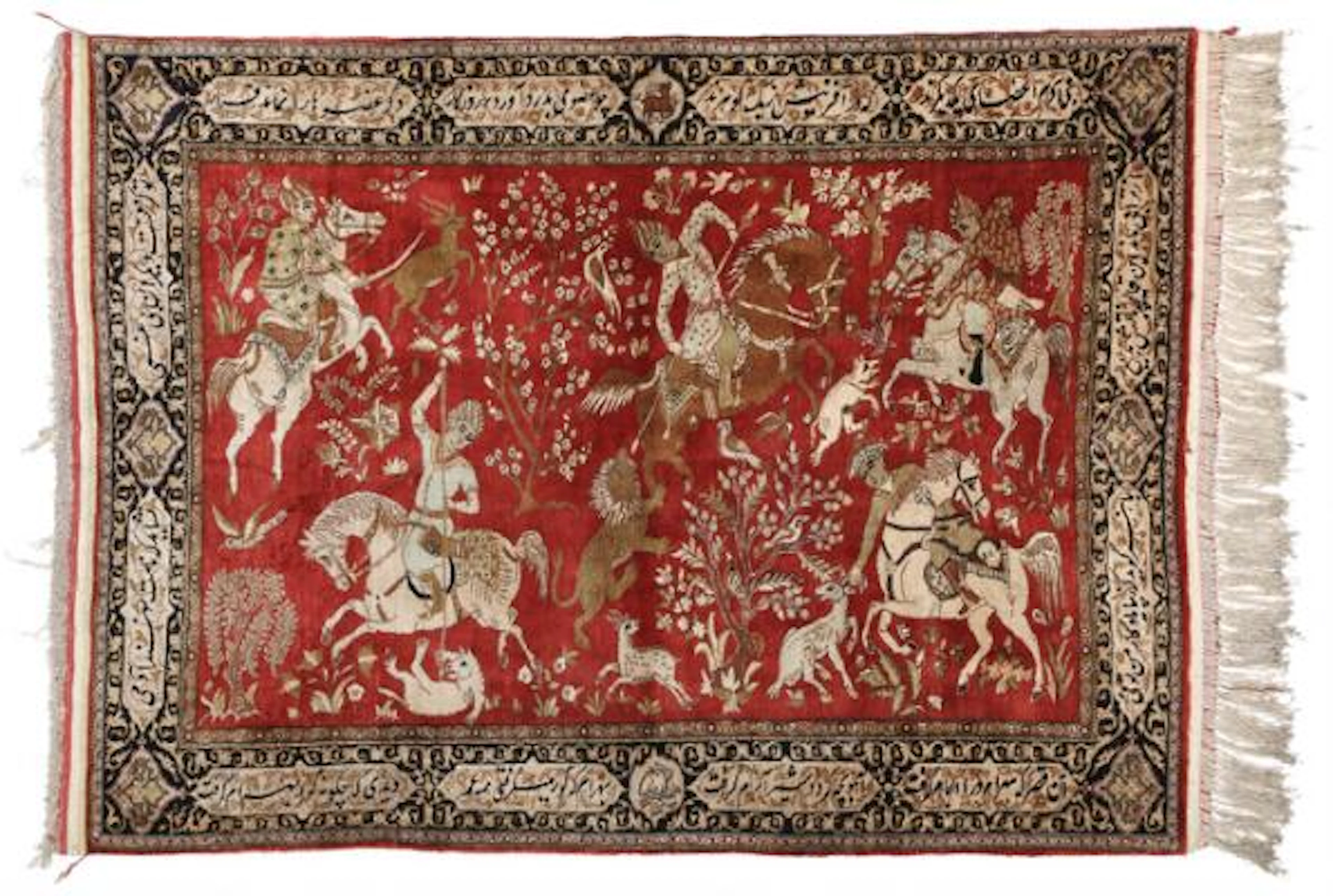 A full silk Qum rug, Persia. Classical hunting scenery surrounded