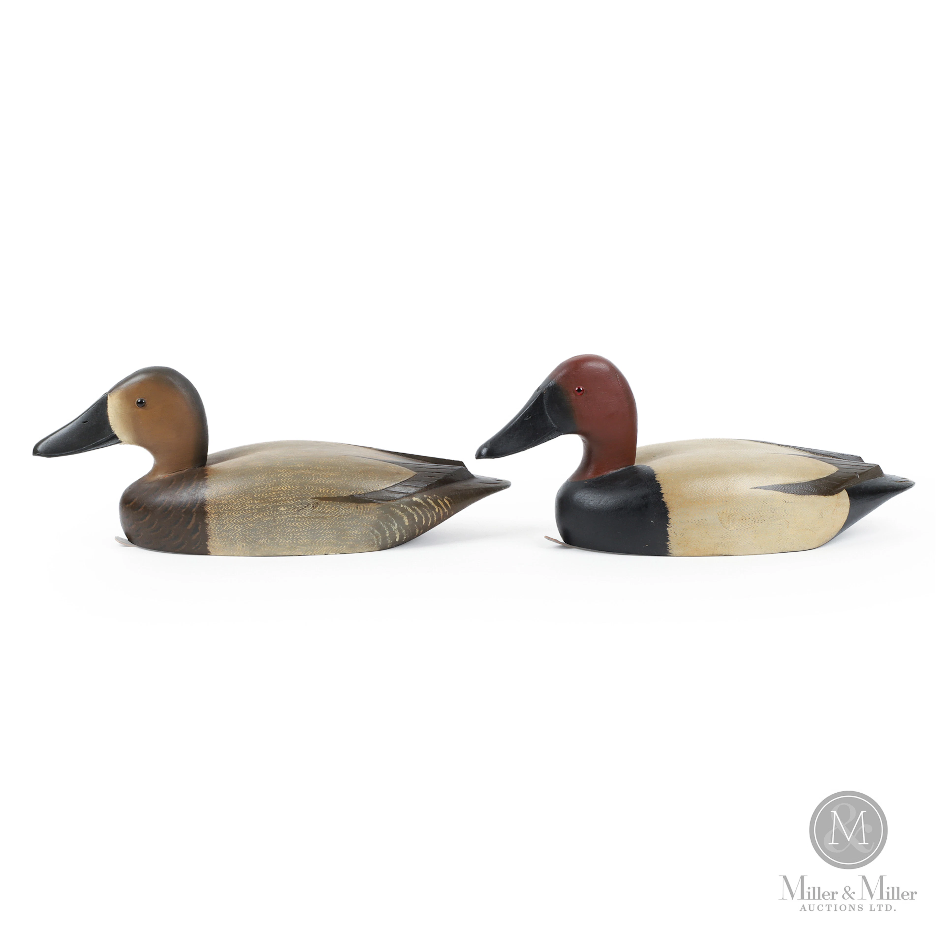 Pair of D. W. "Davey" Nichol Canvasback Decoys