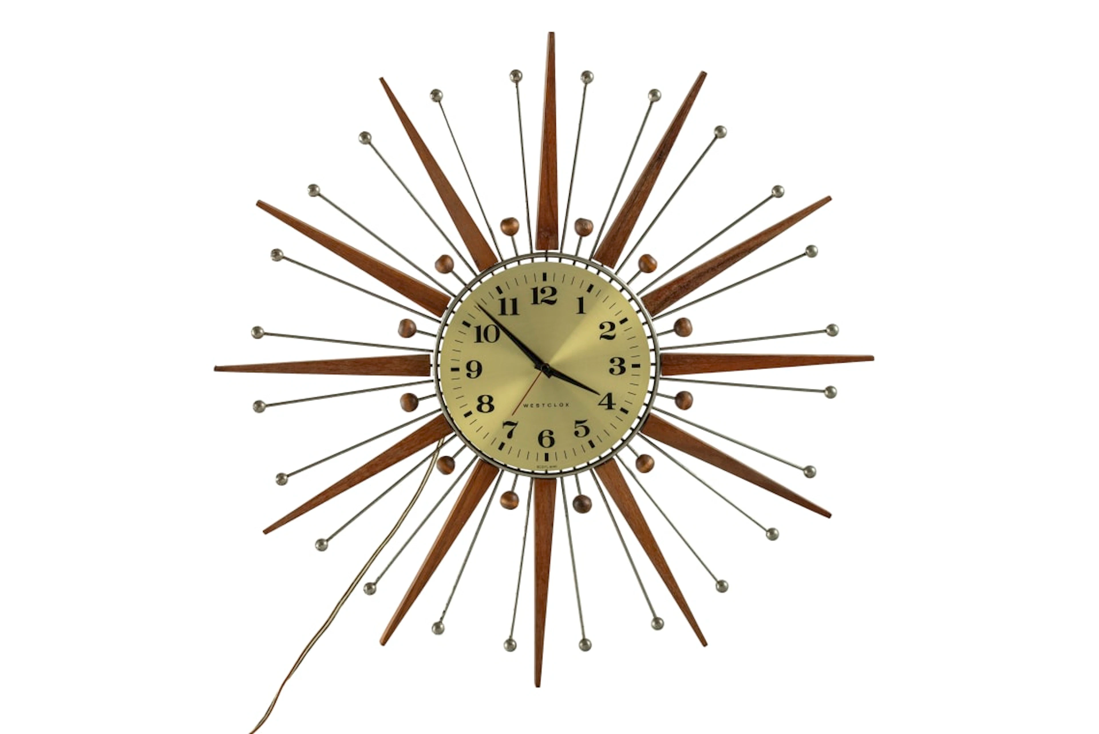 Westclox; Electric atomic-style teak and metal 'Sunburst' wall clock, Scotland