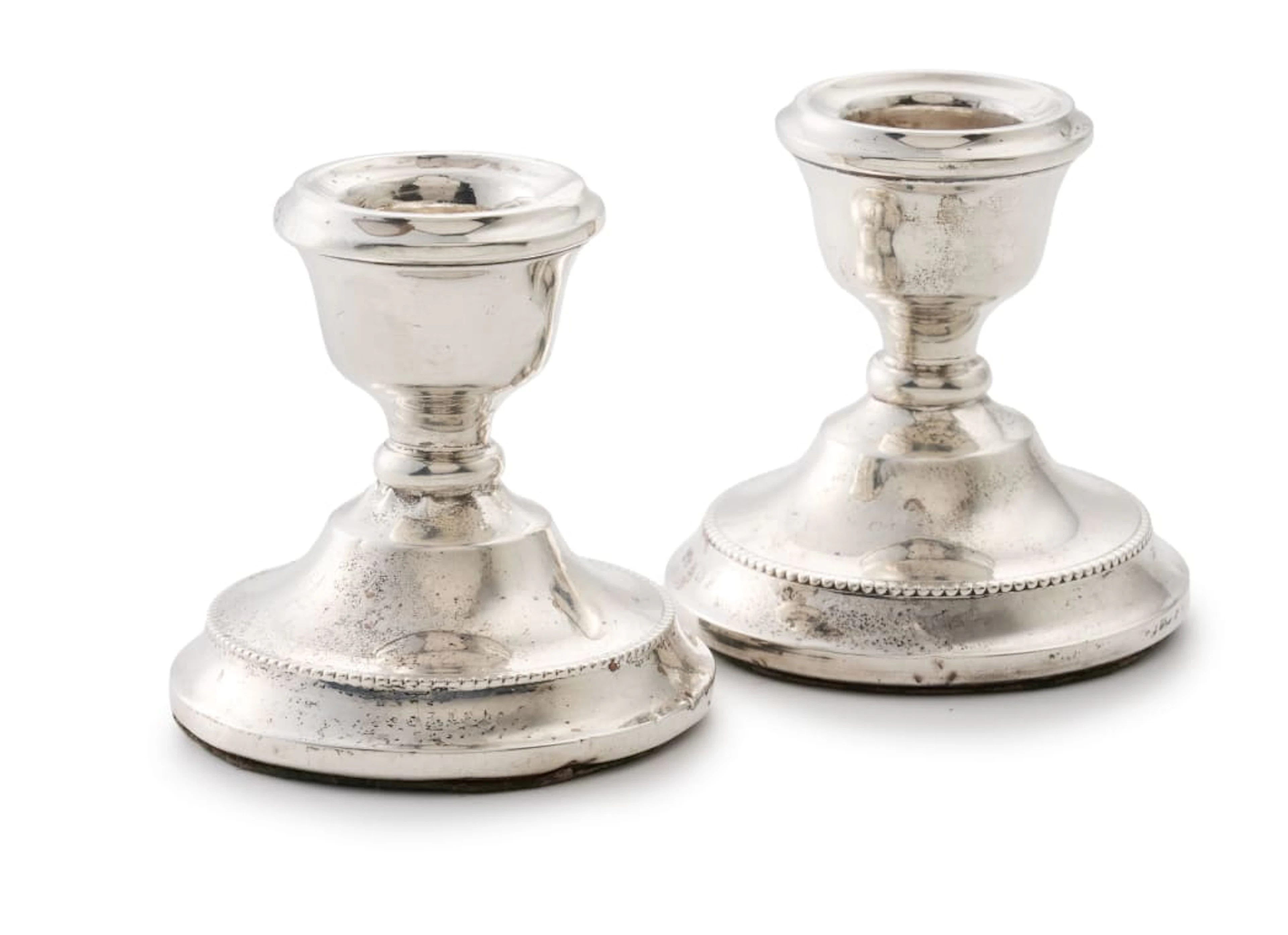 A pair of Elizabeth II silver dwarf candlesticks, Cohen & Charles