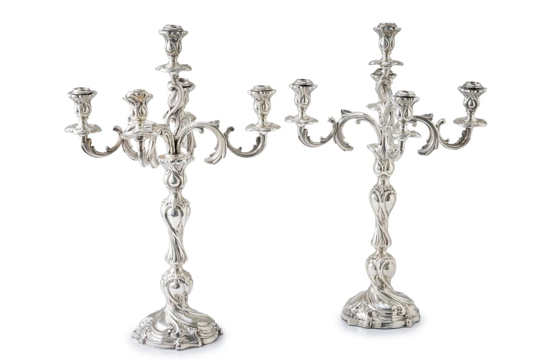 A pair of German silver five-light candelabra