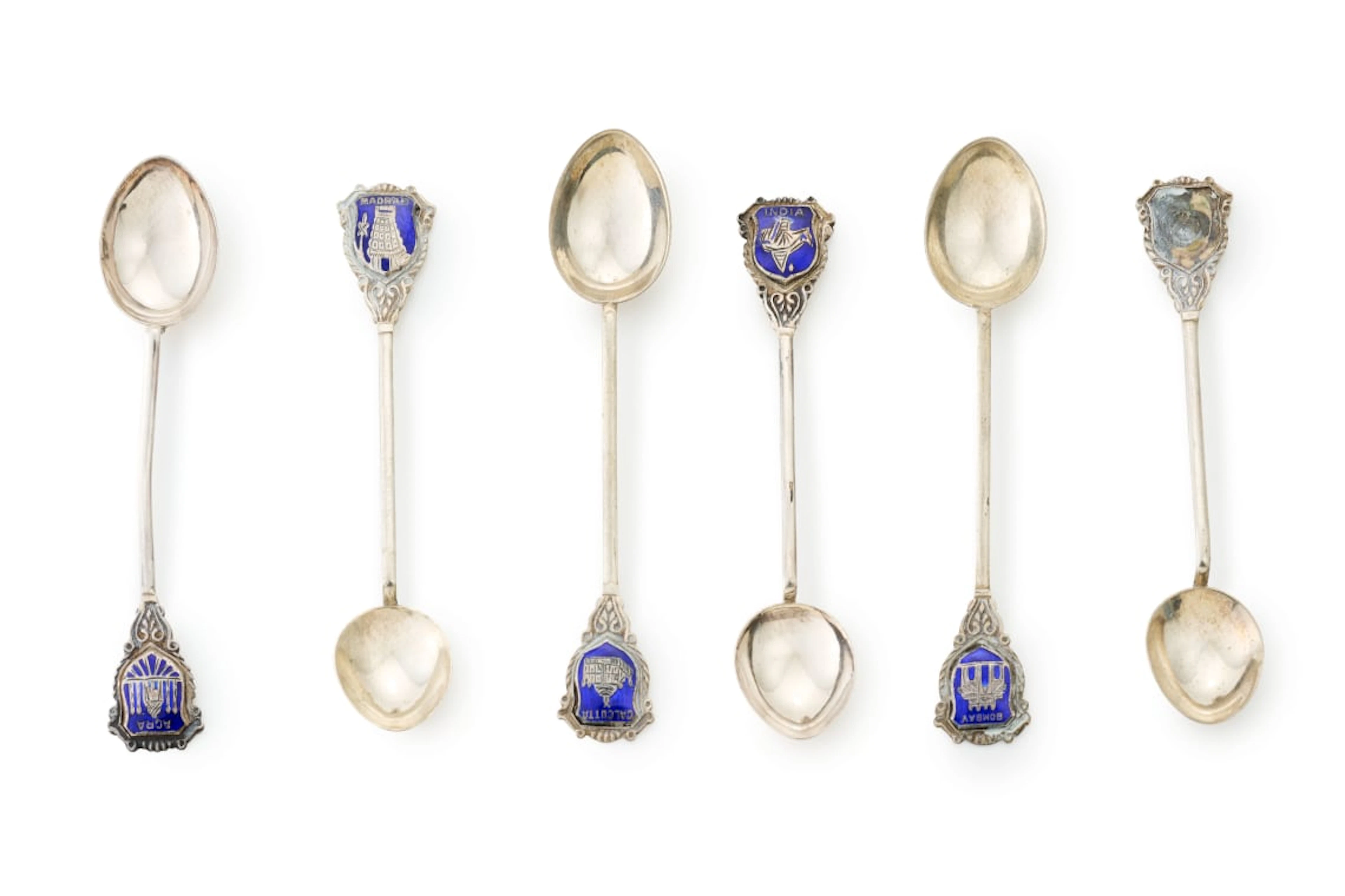Six sterling silver and enamel souvenir teaspoons