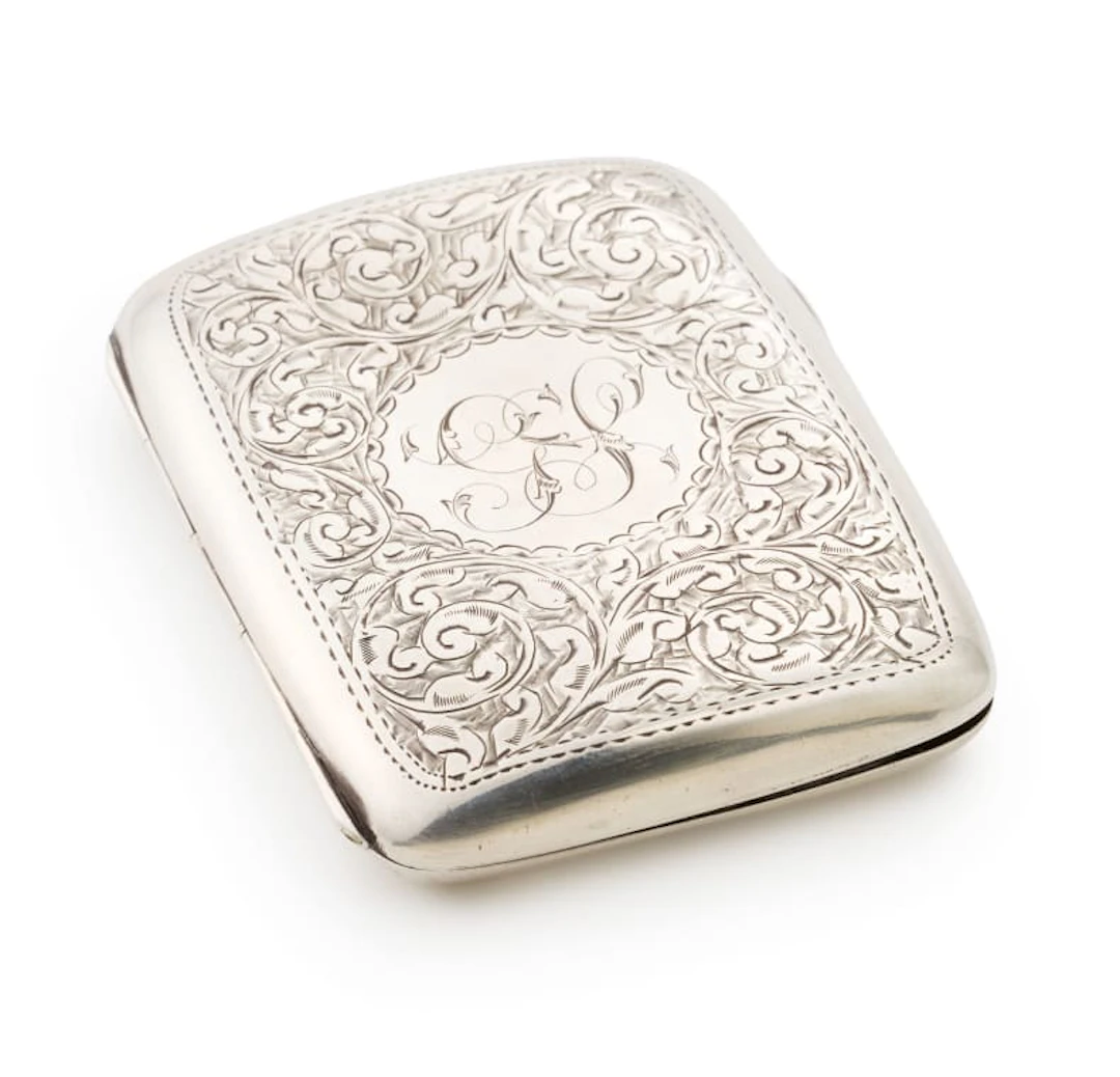 An Edward VII silver cigarette case, The Alexander Clark Manufacturing